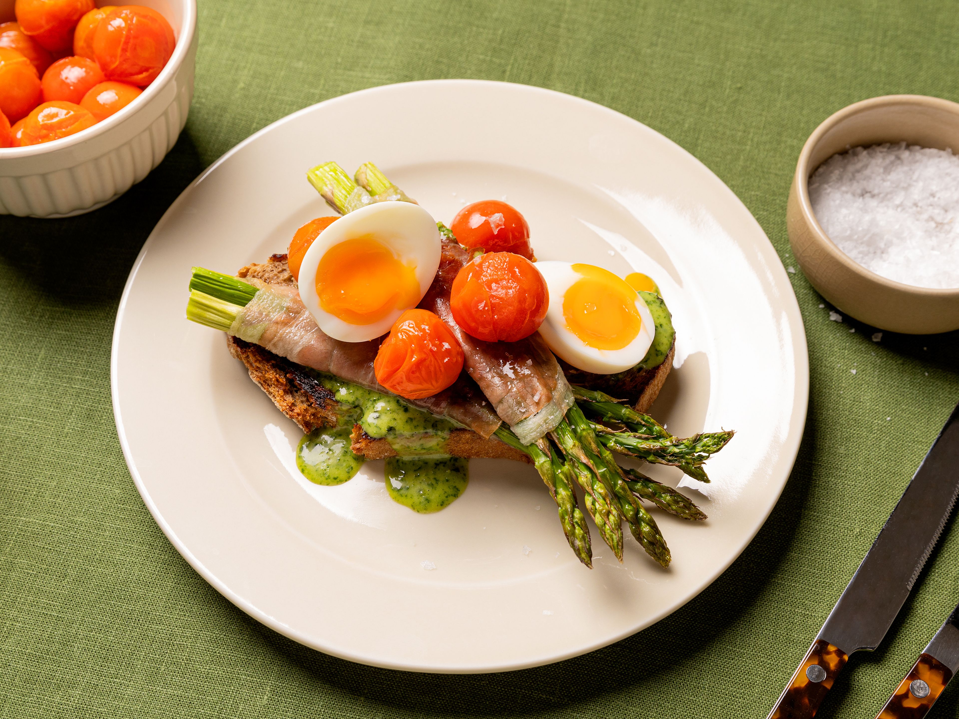 Prosciutto-wrapped green asparagus with jammy eggs and basil mayo