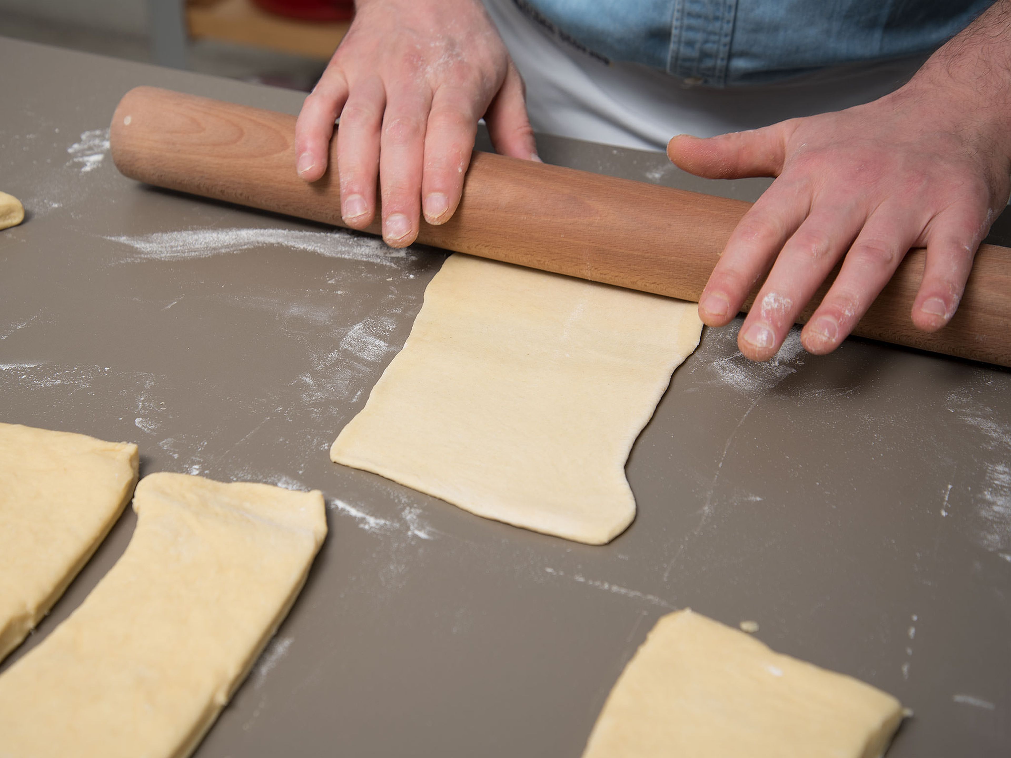 Preheat the oven to 200°C/400°F. Transfer dough to a floured work surface. Knead again briefly, then divide dough into equal parts. Roll out each piece of dough until 20x10 cm/8x4-in. size.