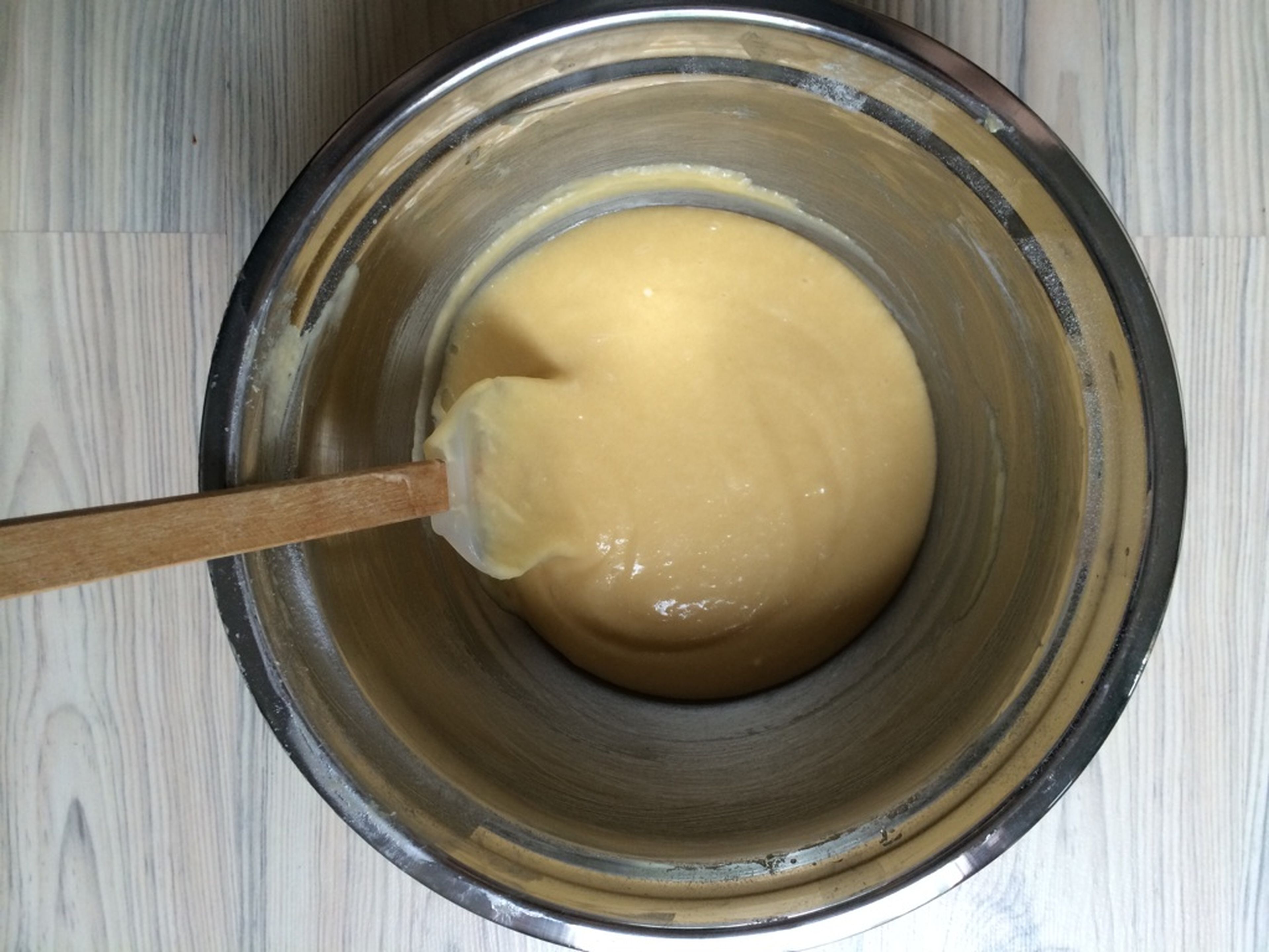 In the bowl of a stand mixer, beat the eggs with the salt. Add sugar and vanilla sugar and mix until just combined. In a separate bowl, combine the flour and baking powder. Add to the mixer, then mix in the melted butter.