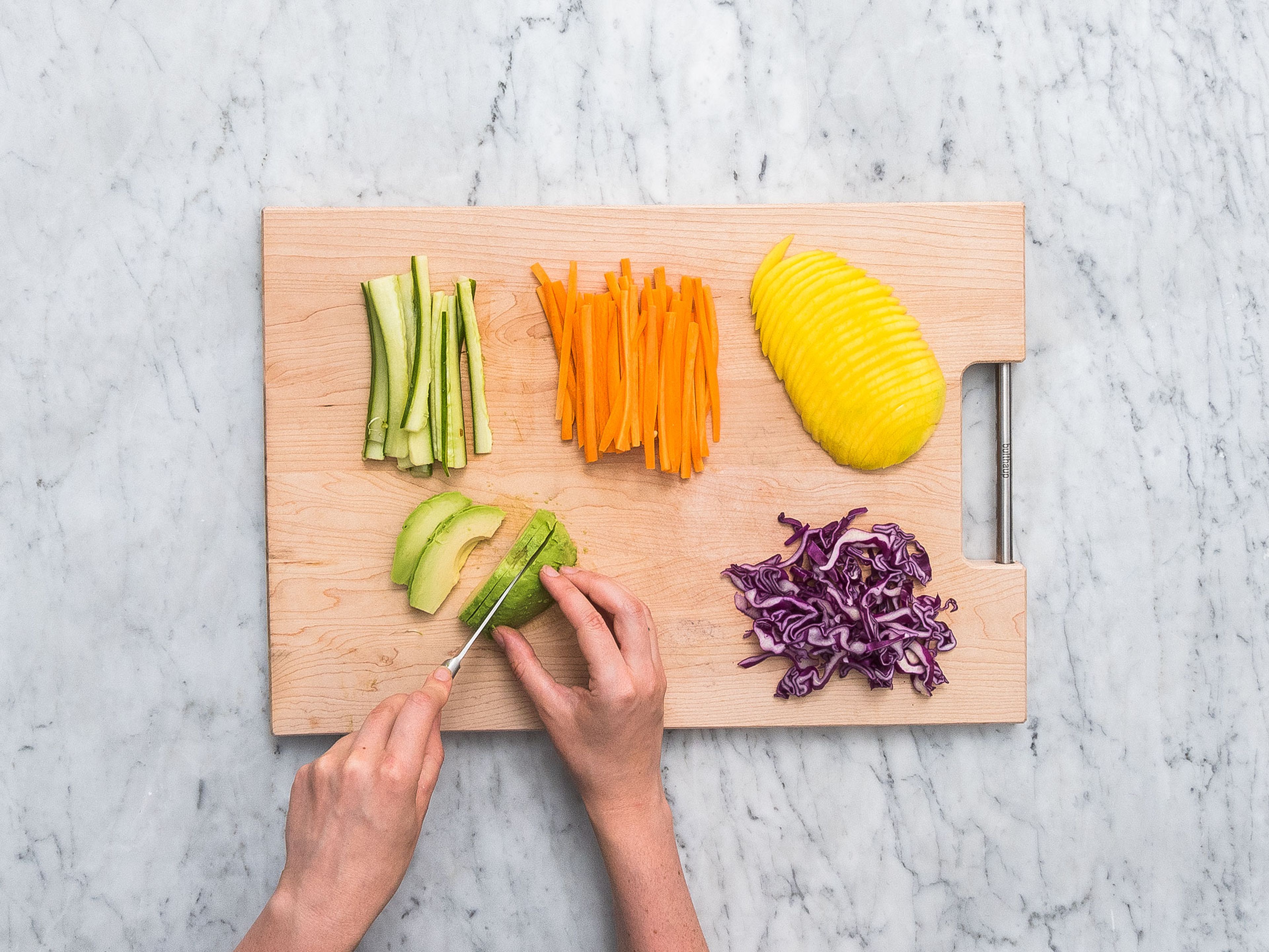Peel and slice the carrots, and chop the cucumber and red cabbage into fine matchsticks. Finely slice mango, radish and avocado. Cut the cress.