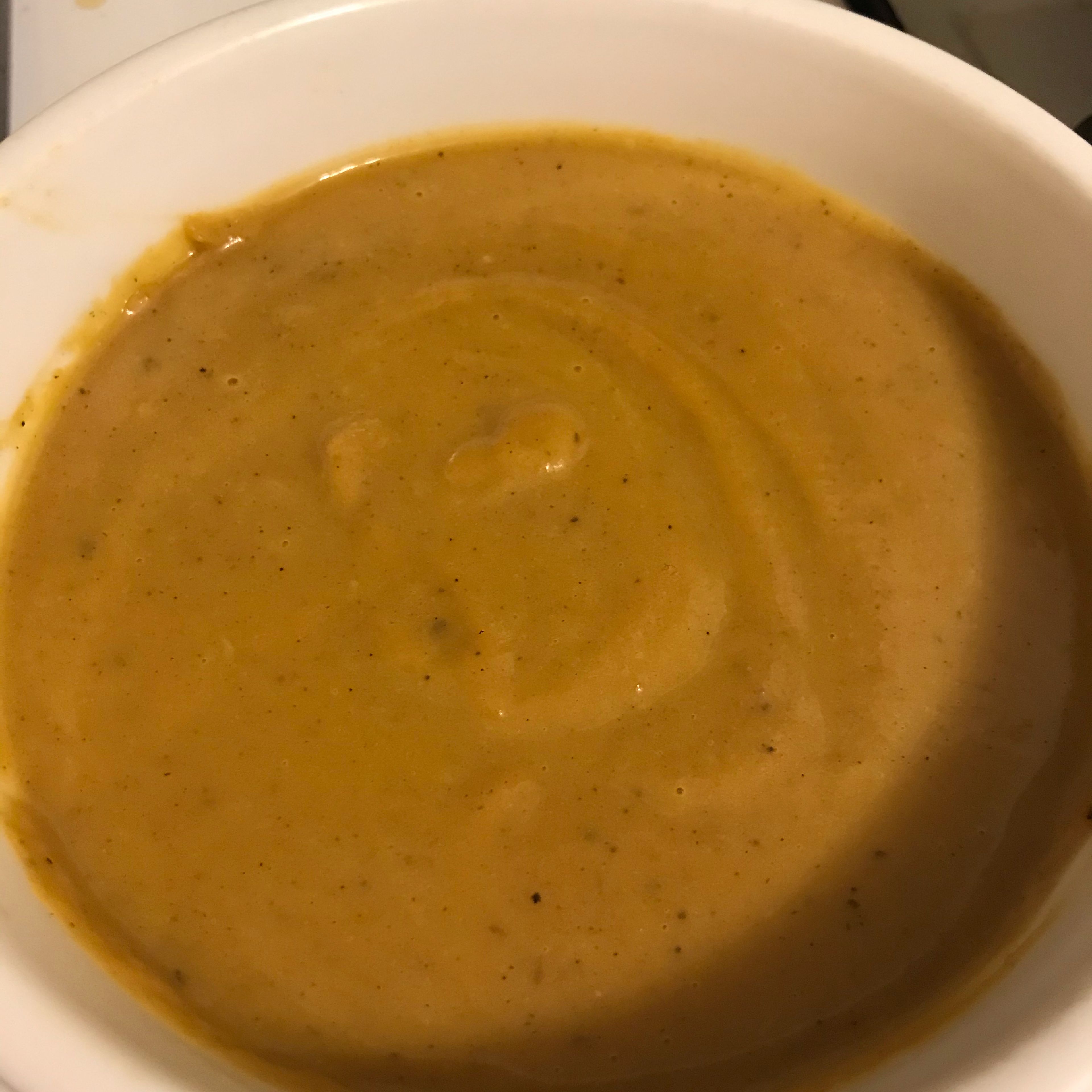 Once the ingredients have come together, remove saucepan from heat. Let the soup cool slightly before puréeing with an immersion blender, food processor, or blender in batches. Soup should be a creamy thickness. Enjoy!