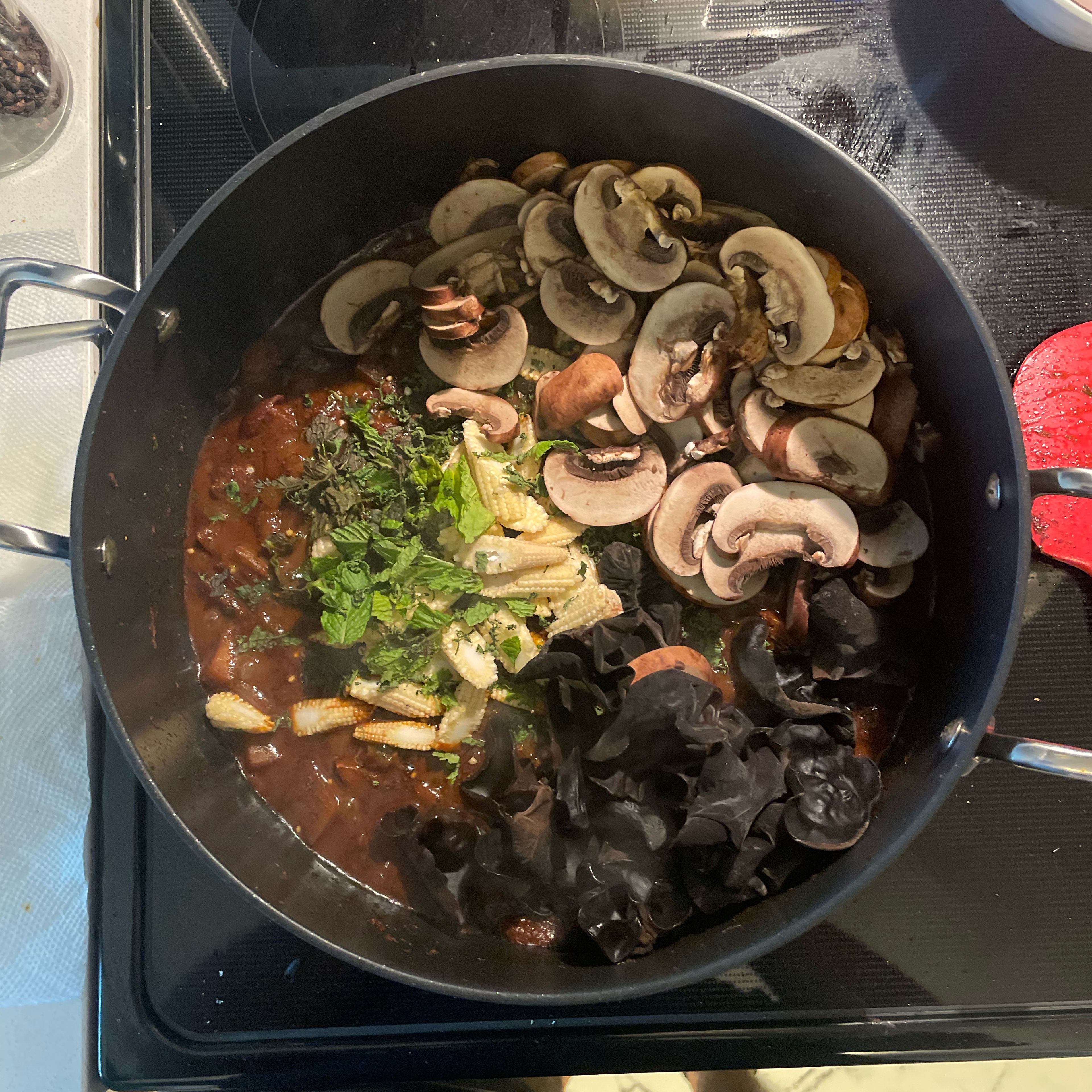 Add baby corn. Mushrooms. Mint. And Cilantro. Cook time: 7-12mins at med-high flame. 