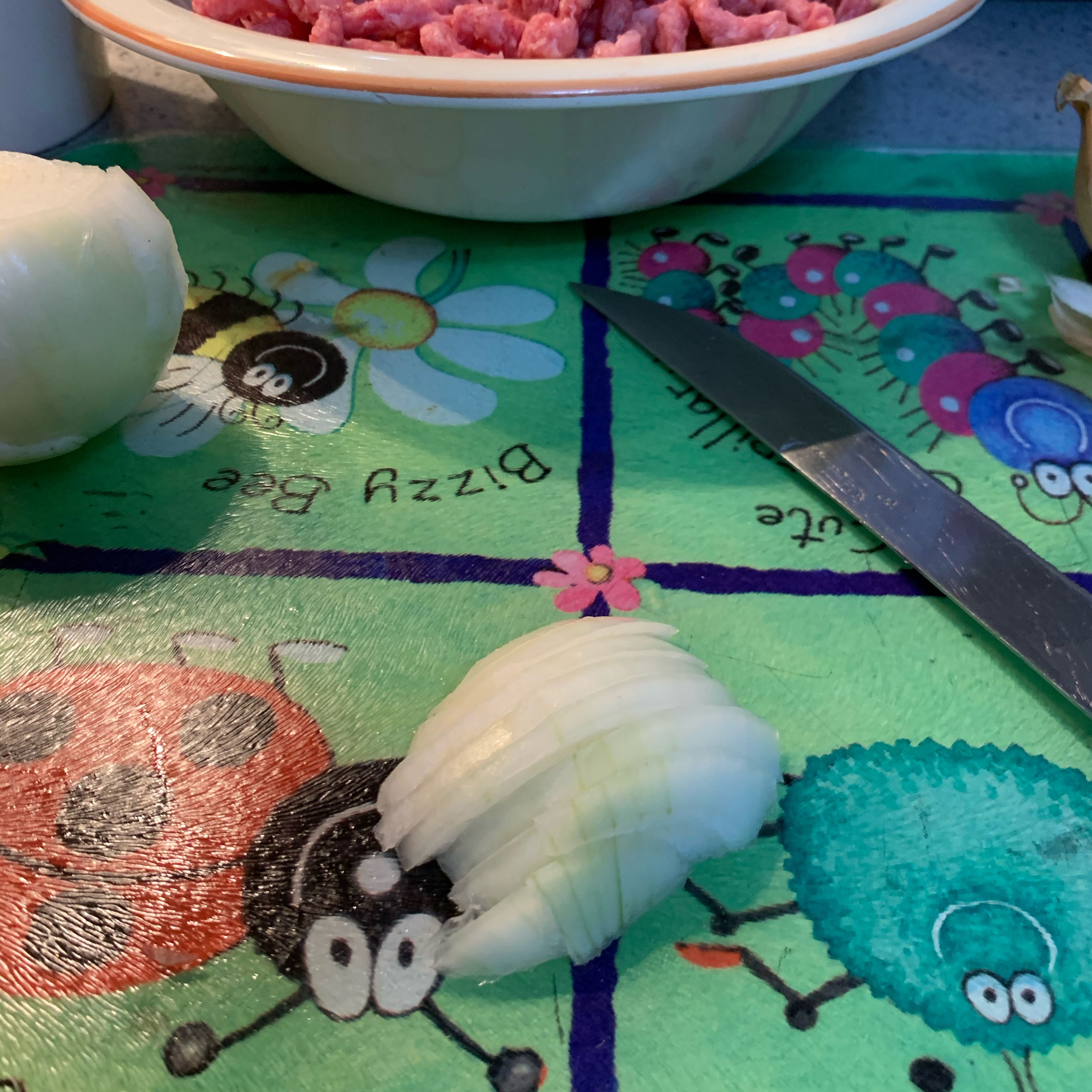 Cut half an onion or a whole (if preferred) in slices like this or cubes.