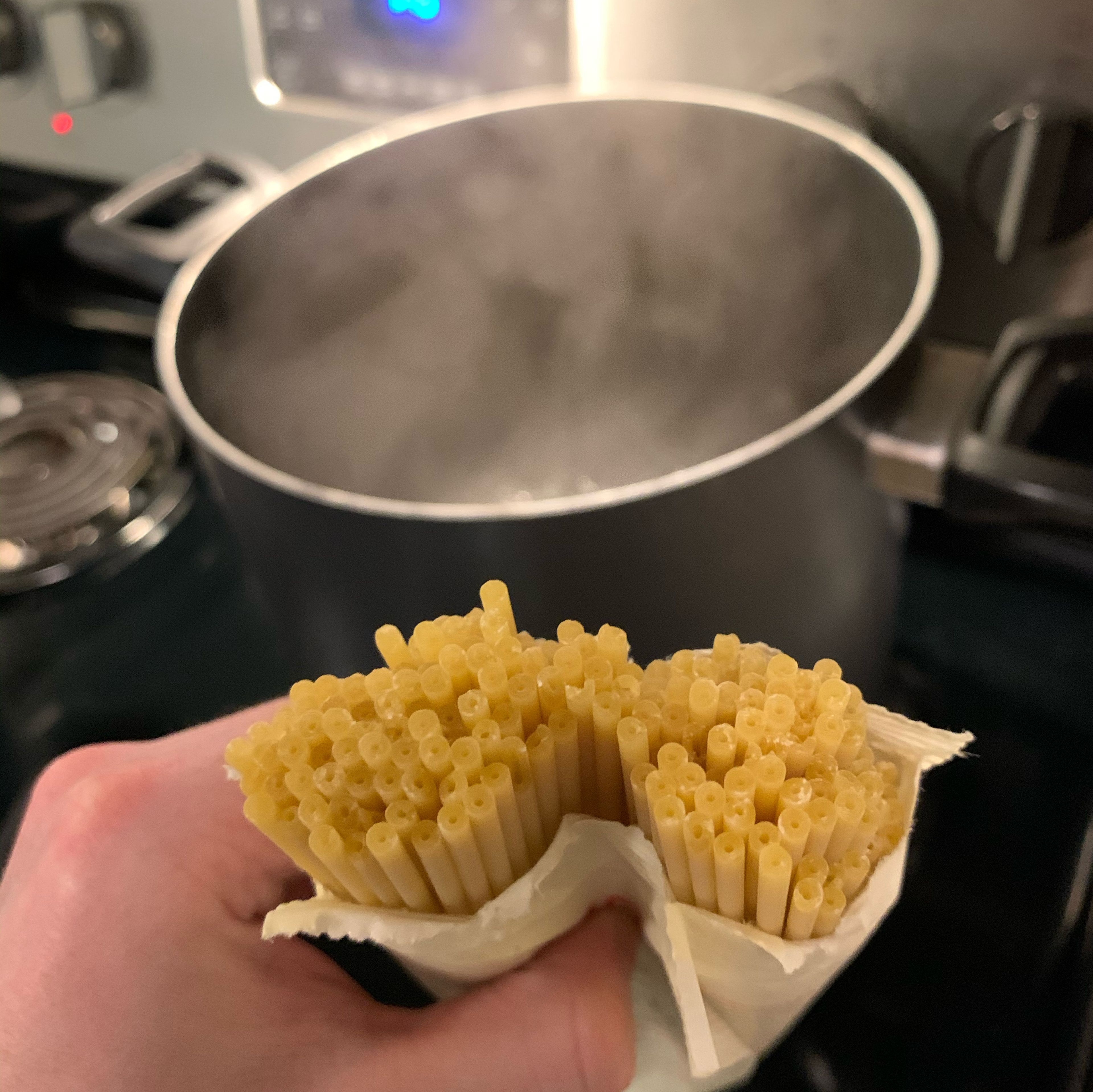 When water starts boiling, add half a package of bucatini and reduce heat to medium high to prevent boiling over. Follow cooking instructions on package. About halfway through cooking, turn heat off on pancetta.