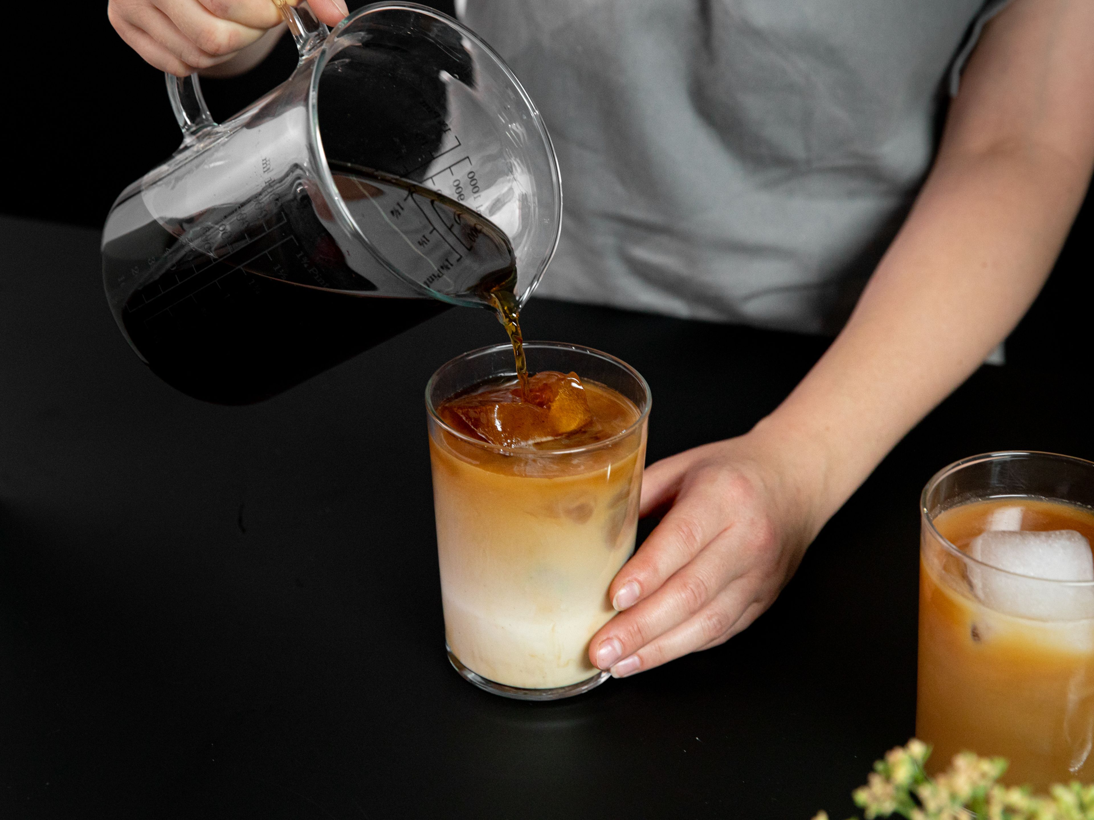 For cold brew ice cubes, add most of the cold brew to ice cube trays and freeze until solid. Add cold brew ice cubes, milk, and some extra cold brew to a glass and enjoy.