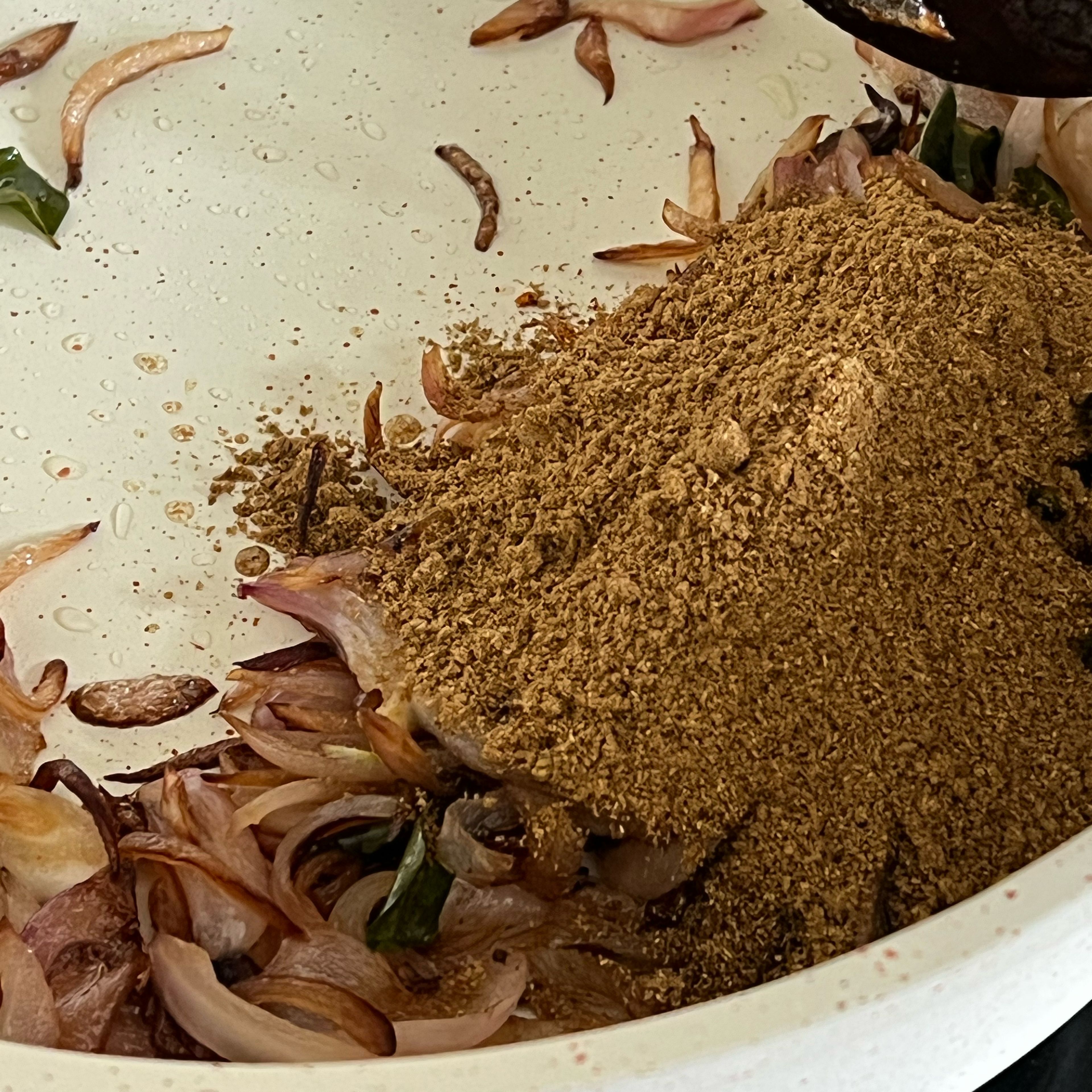 Add the curry leaves and sauté for a minute. (You can also add a diced tomato if you want a bit more tanginess.) Add the rest of the masalas - garam masala, coriander powder & pepper. 