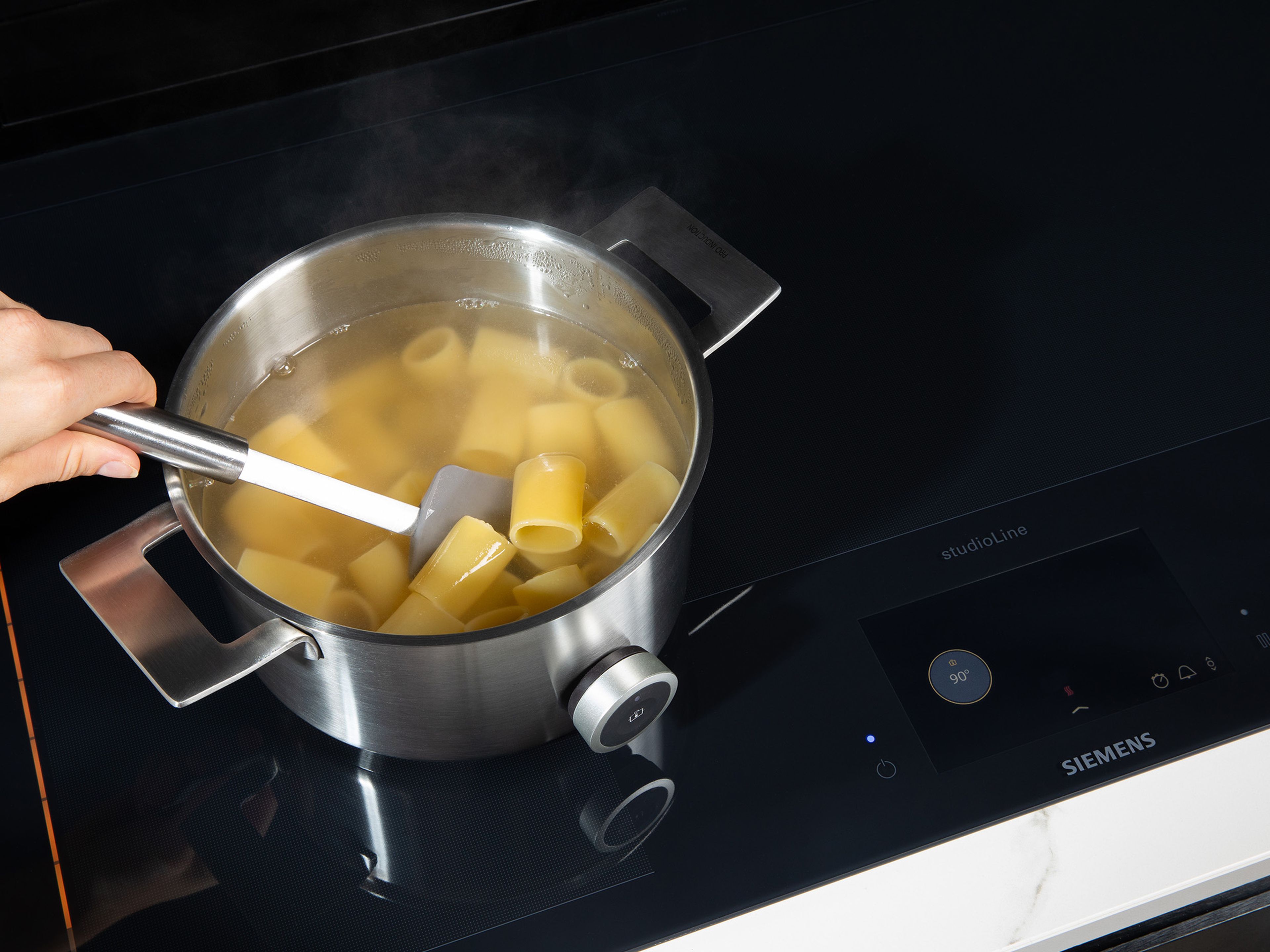 In the meantime, bring a large pot of water to a boil and cook paccheri pasta according to package instructions. Drain and reserve some pasta water.
