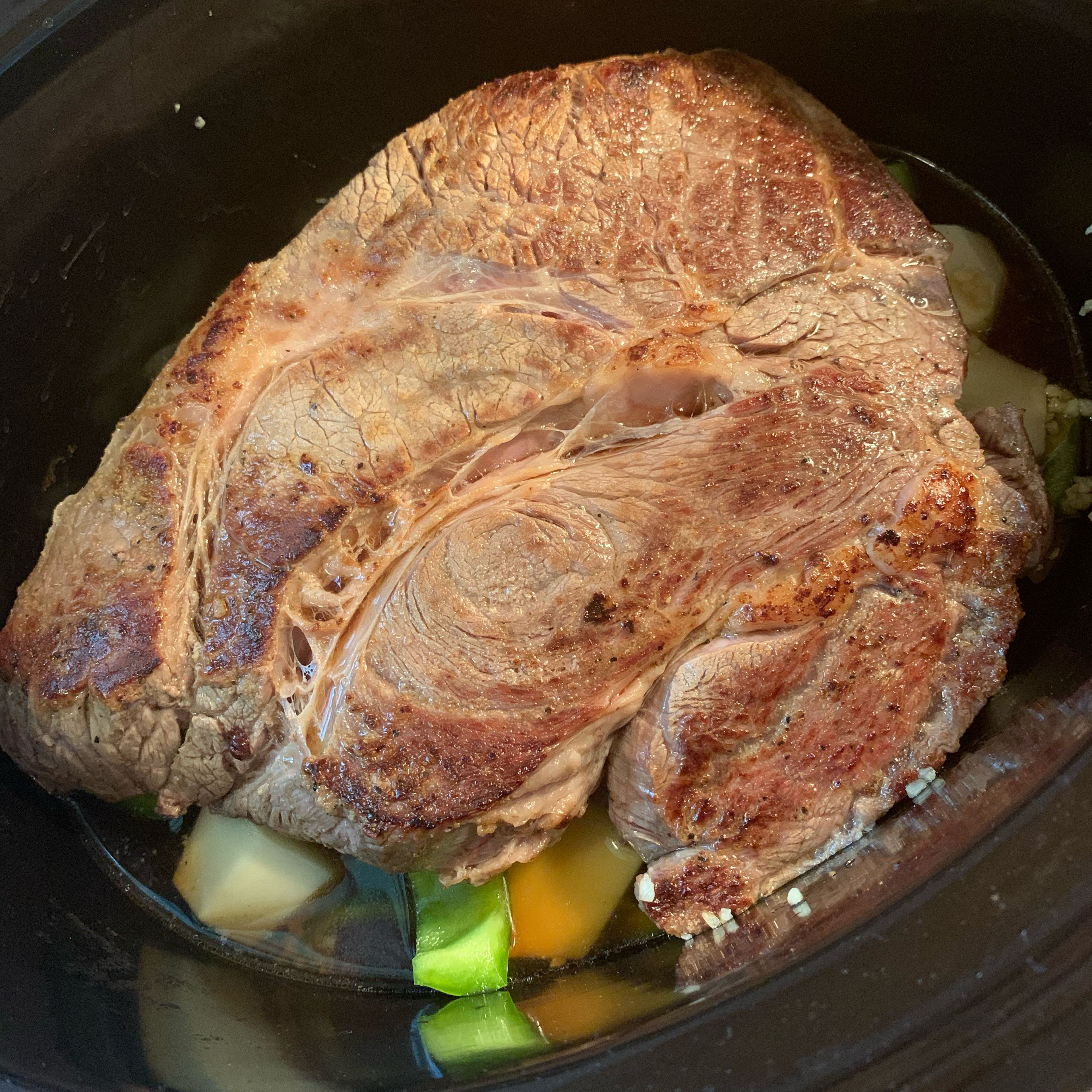 Take all of your veggies and place them in an even layer at the bottom of your crockpot. That will include potatoes, bell peppers, yellow onion, and minced garlic. Place your roast over the top of your veggie layer and pour 2 cups of beef broth over the entire roast. Place the lid on your slow cooker. Cook on high for 7-8 hours or on low for 5-6 hours.