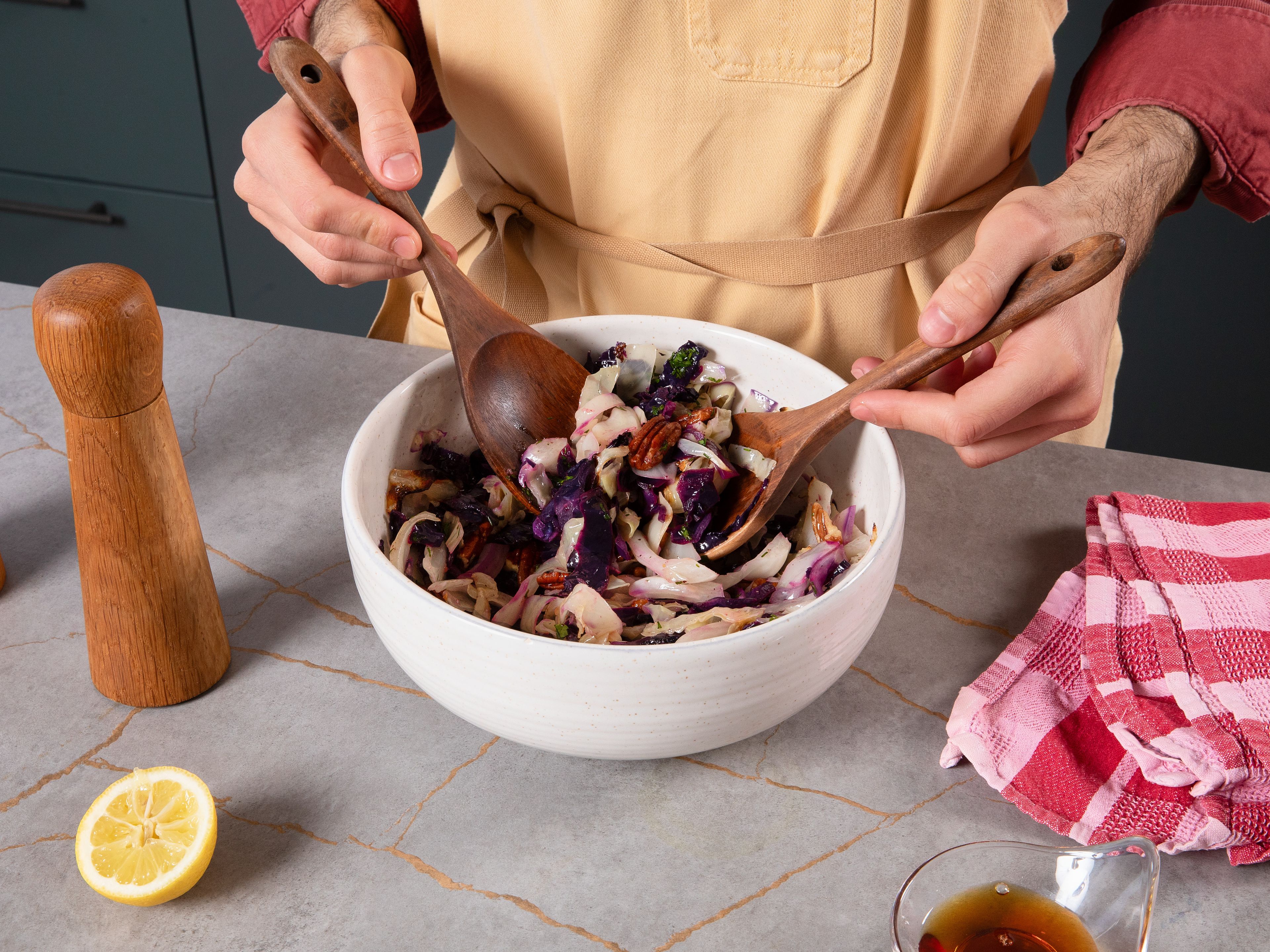 Once cabbages are done, let them cool for approx. 2 min. Then, transfer them to a big mixing bowl and pour vinaigrette on top. Mix well and garnish with fresh dill and parsley for serving.