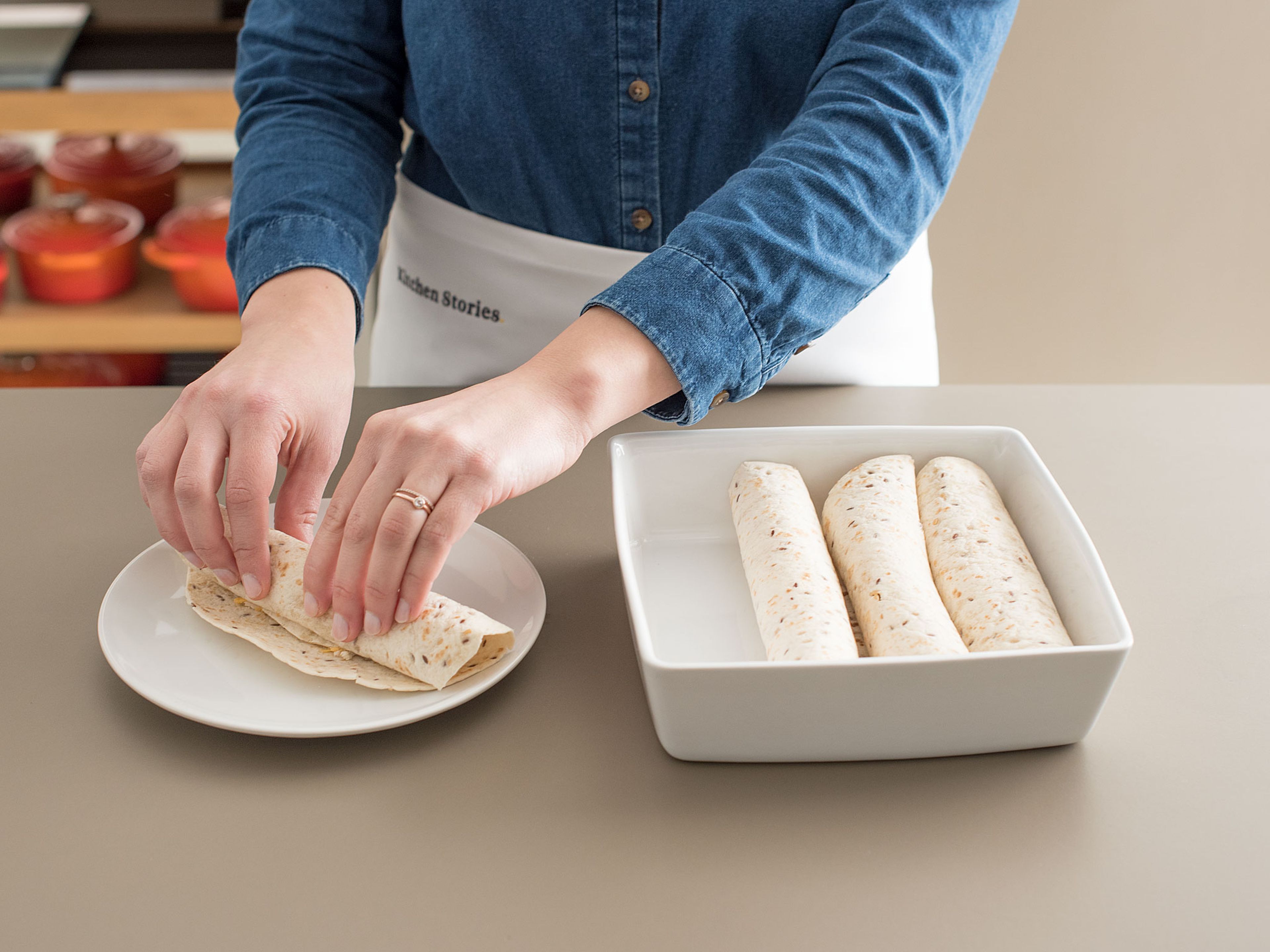 Roll up the tortillas and place seam-side-down in baking dish.