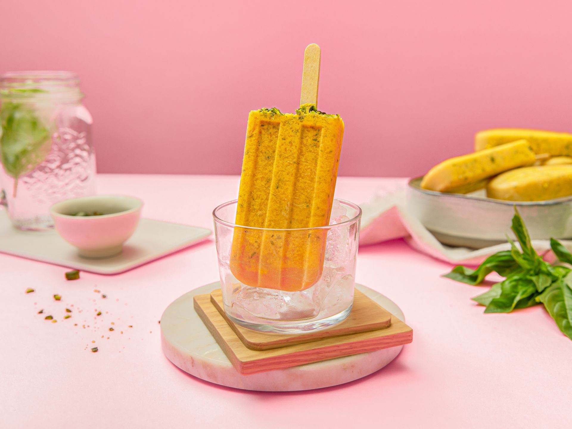 Cantaloupe-basil popsicles with pistachios