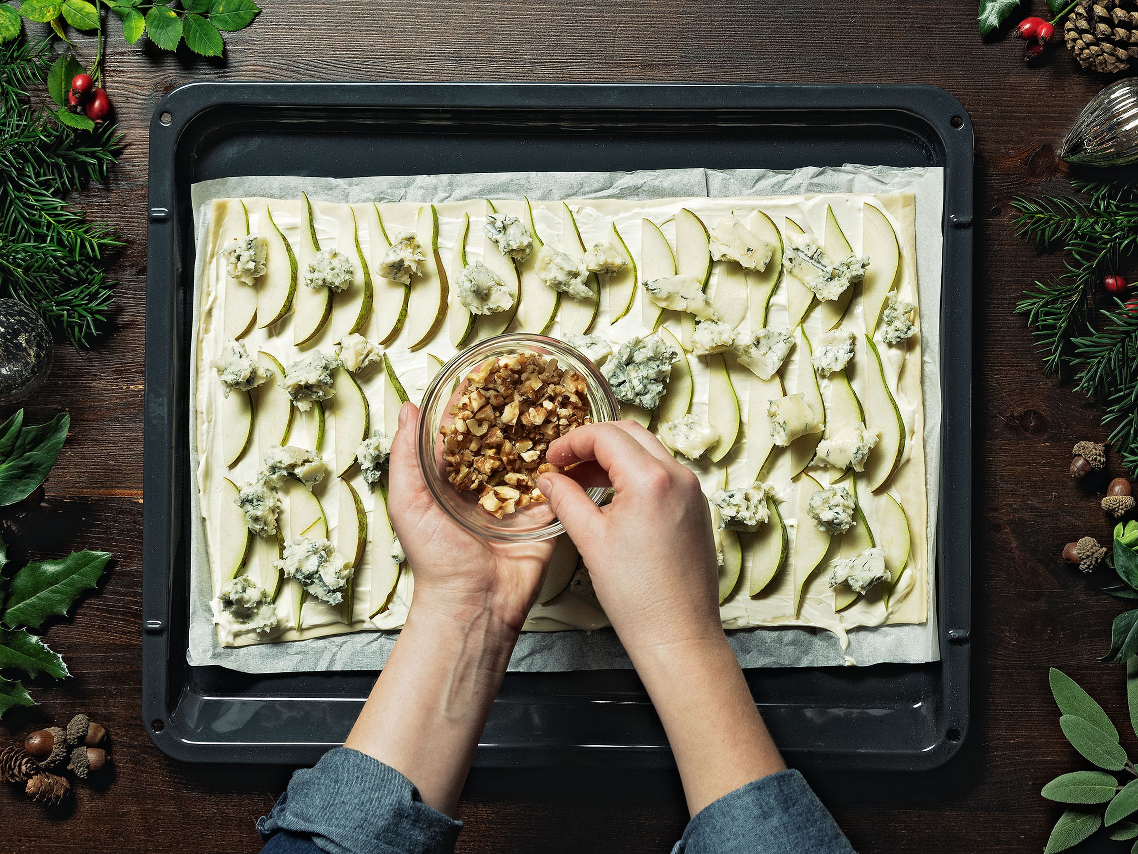 Spread the pastry onto a baking sheet lined with baking paper. Distribute the creme fraiche evenly over it. Spread the pears onto the pastry and, using your hands, crumble the Gorgonzola over the top. Sprinkle with walnuts and thyme, season with salt and pepper, and drizzle with honey.