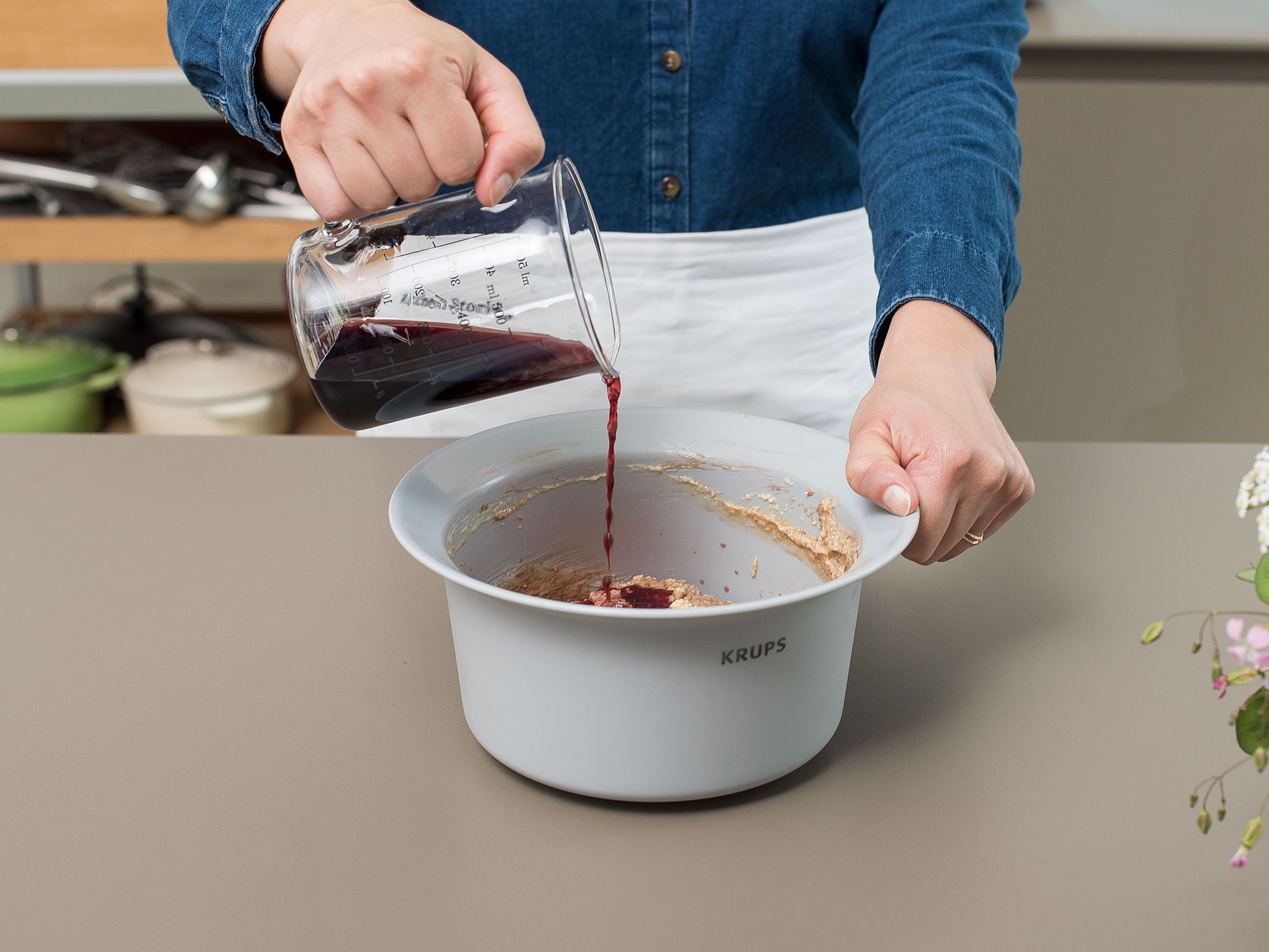 Add the red wine to the bowl alternately with the flour mixture and stir until just combined. Chop some of the chocolate and fold it into the batter.