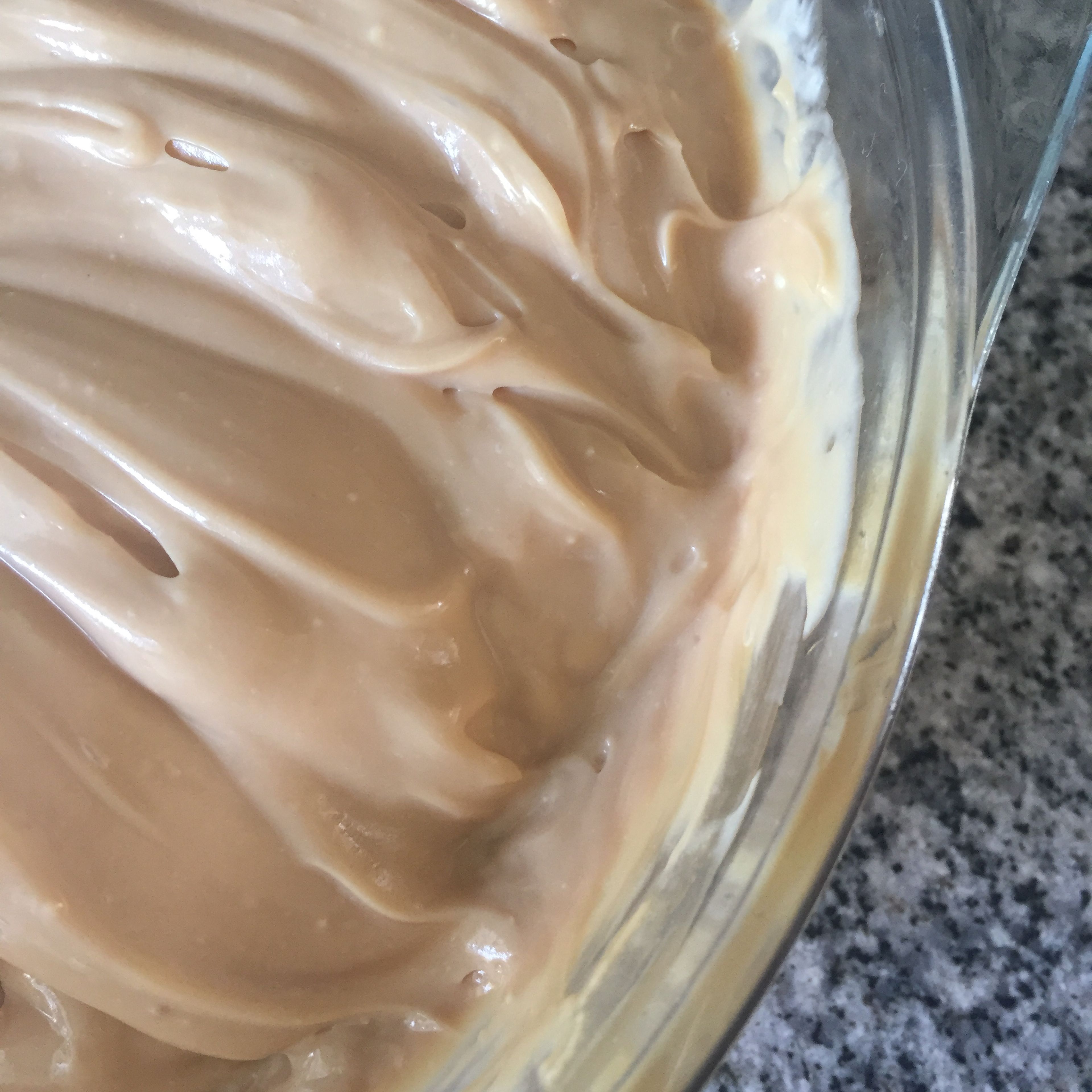 Stir together cream cheese and dulce de leche until all combined. Different brands of dulce de leche might change the color or consistence of the filling. 