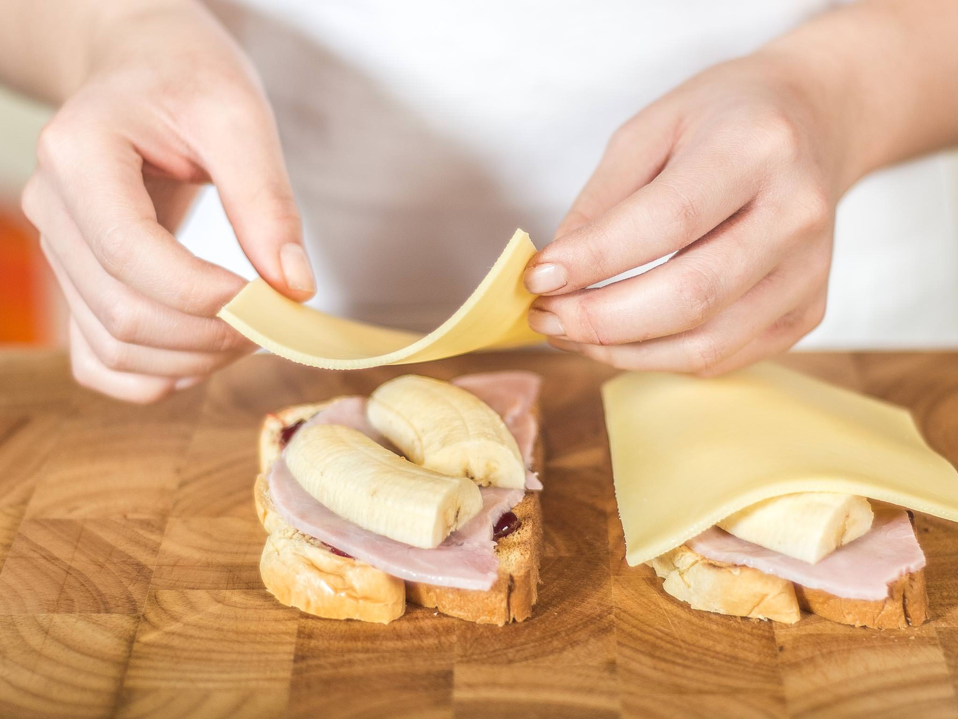 Next, place a slice of ham, banana, and then cheese on the brioche.