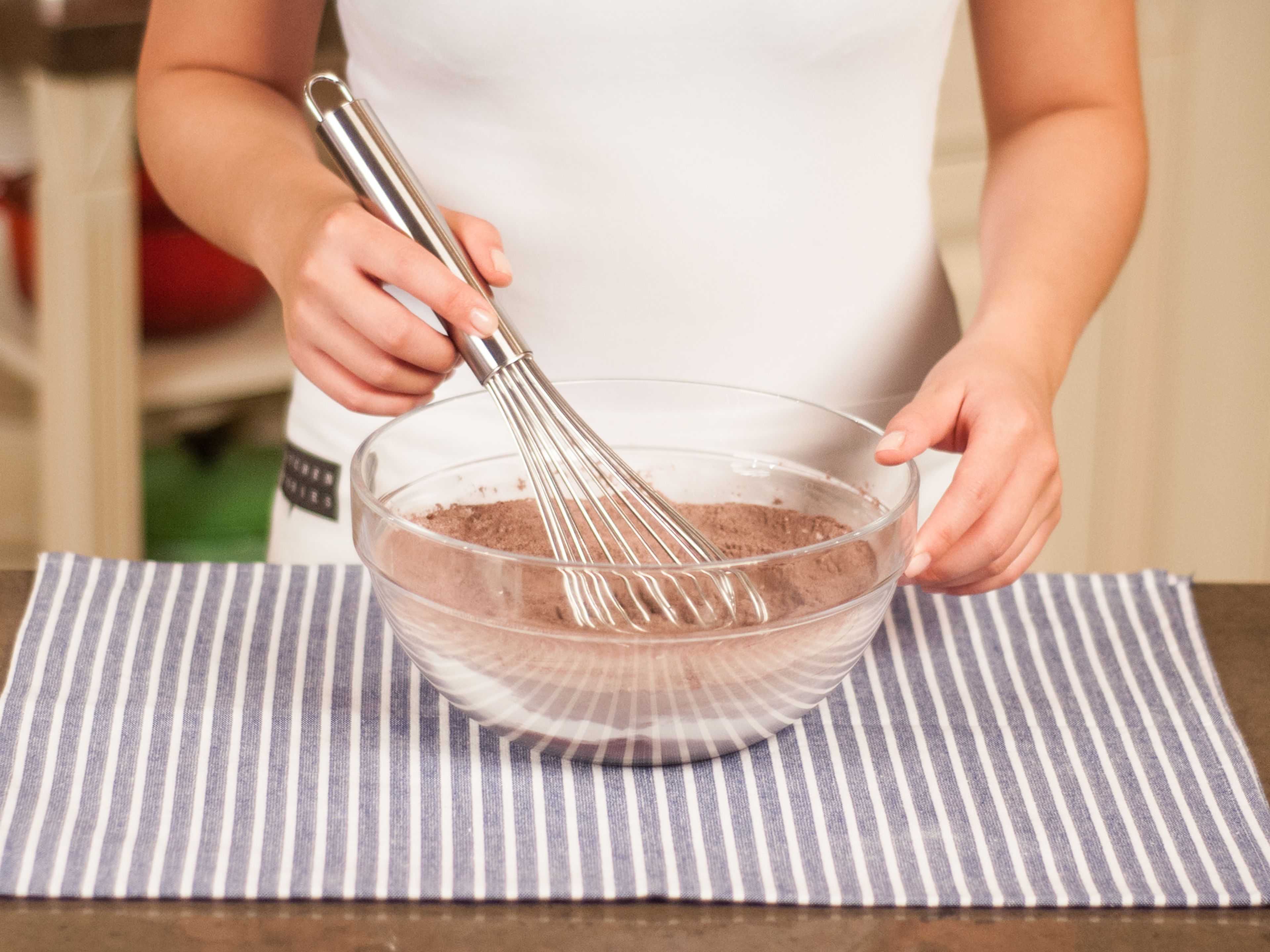 In a large bowl, whisk together cocoa powder, all-purpose flour, sugar, baking powder, and seeds from the vanilla bean.