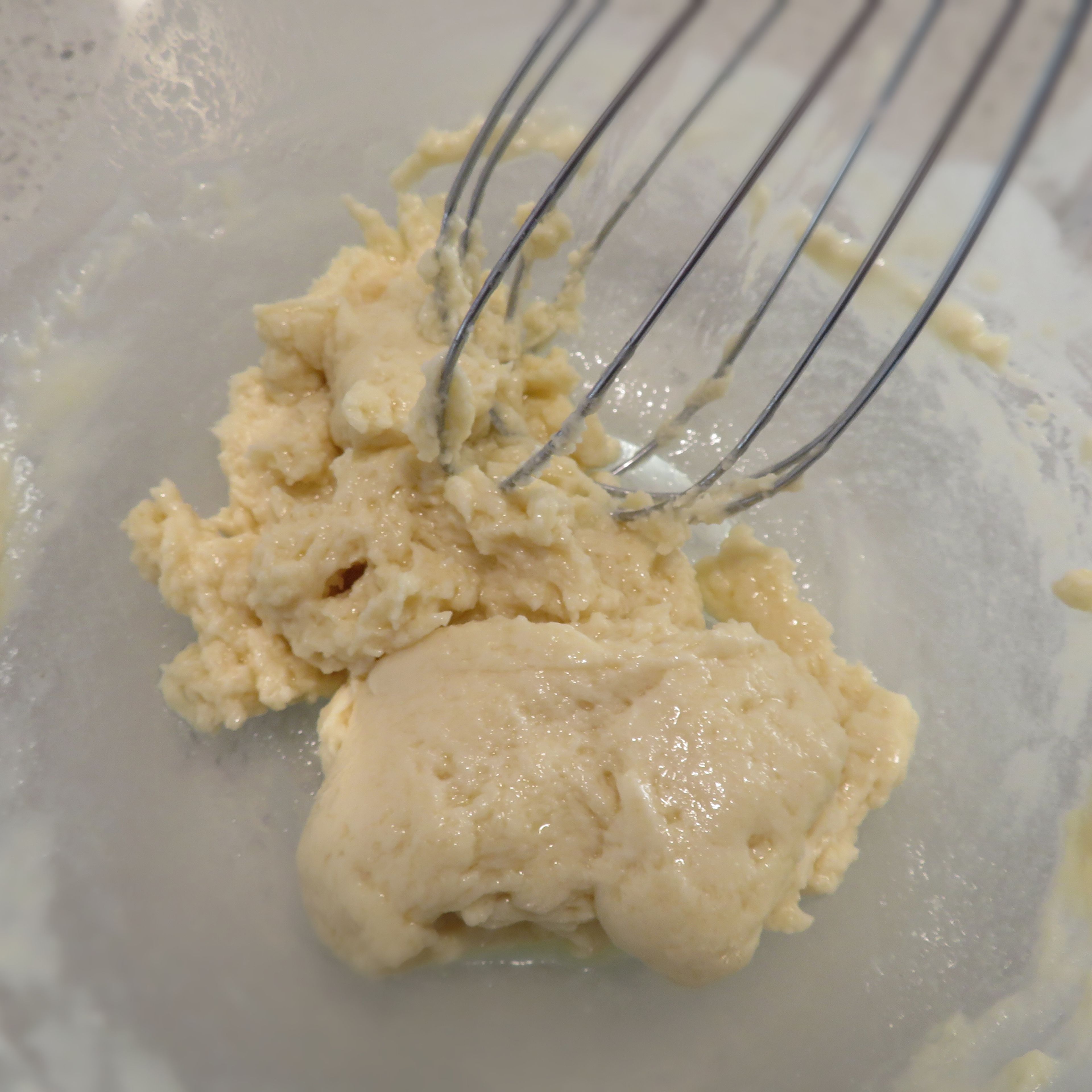 Add milk to oil and flour mixture and mix well until a dough like substance.