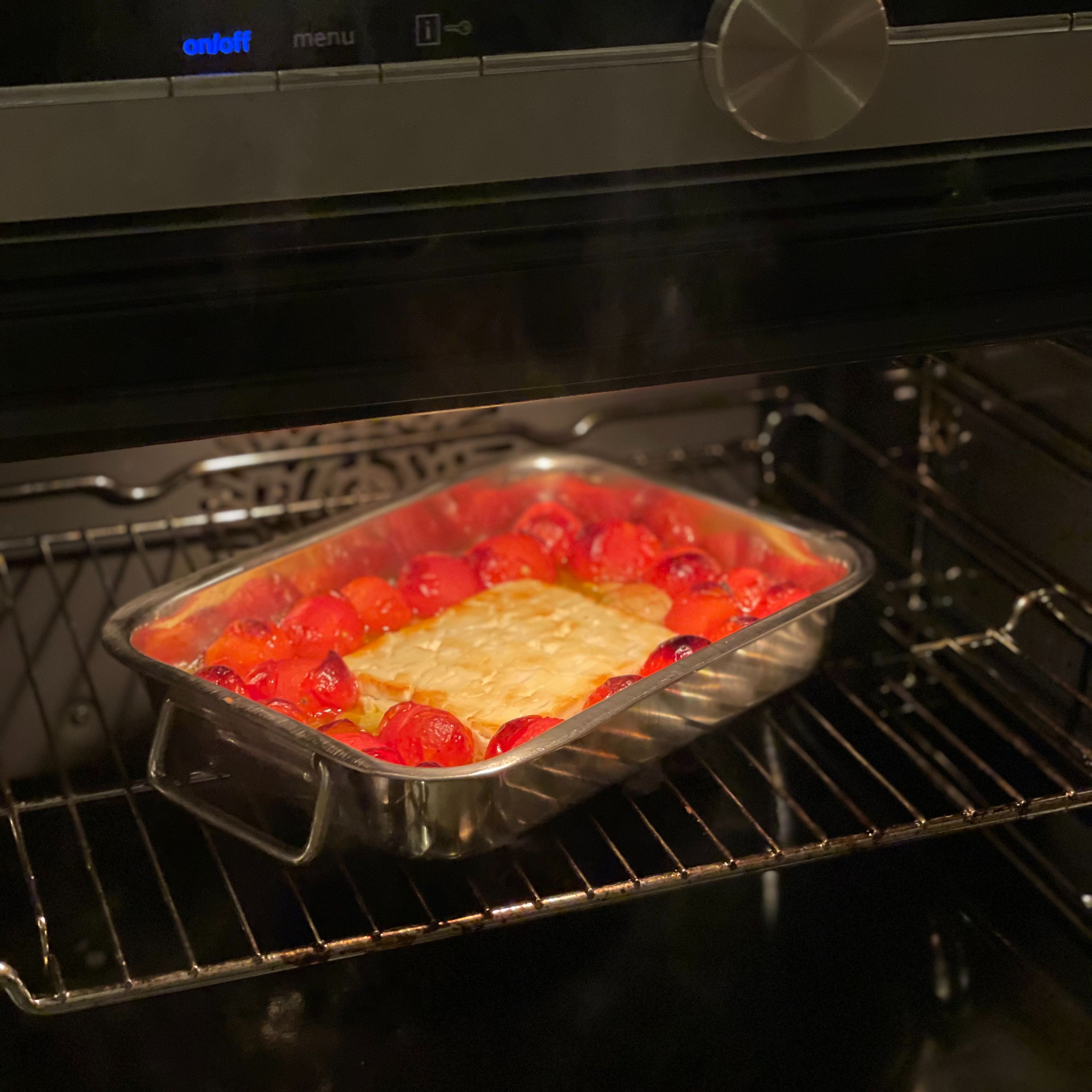 Take you baking tray from the oven and add a dash of pasta water from your cooking pasta. Mix the mixture crushing your tomato’s to prepare your sauce.