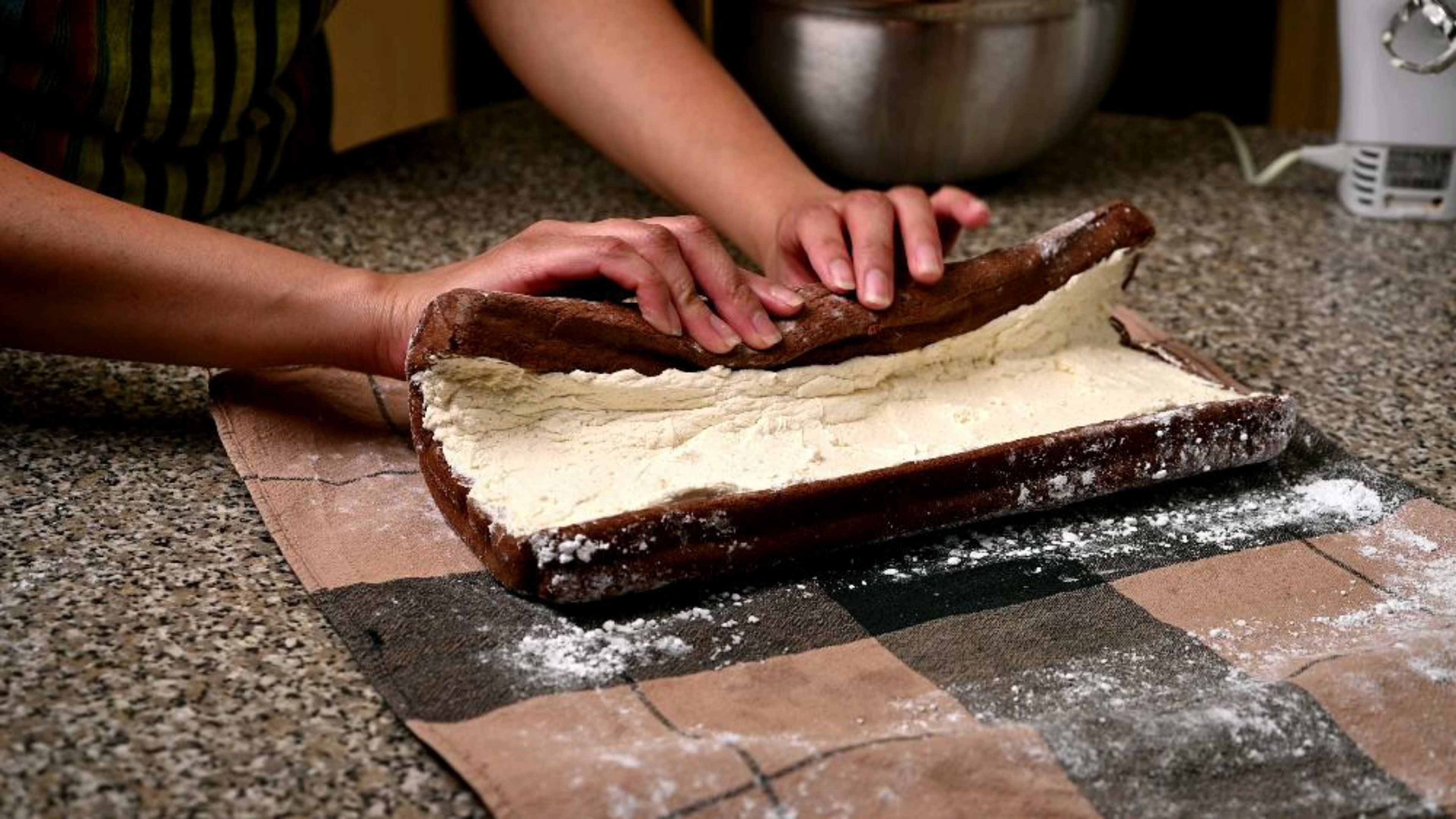 Carefully unroll the cake and evenly spread the cream filling onto the cake. Roll the cake - making sure its tightly rolled and place the cake on a tray or a plate.