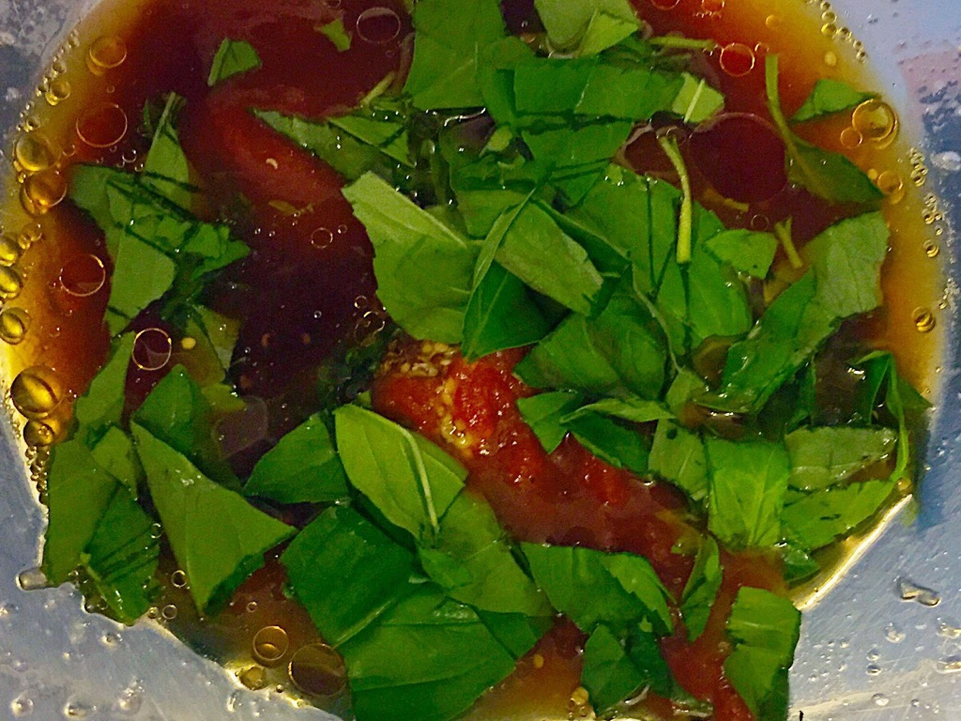 Roughly chop half of the basil, then add to a bowl along with the lemon juice, olive oil, soy sauce, and sesame oil.