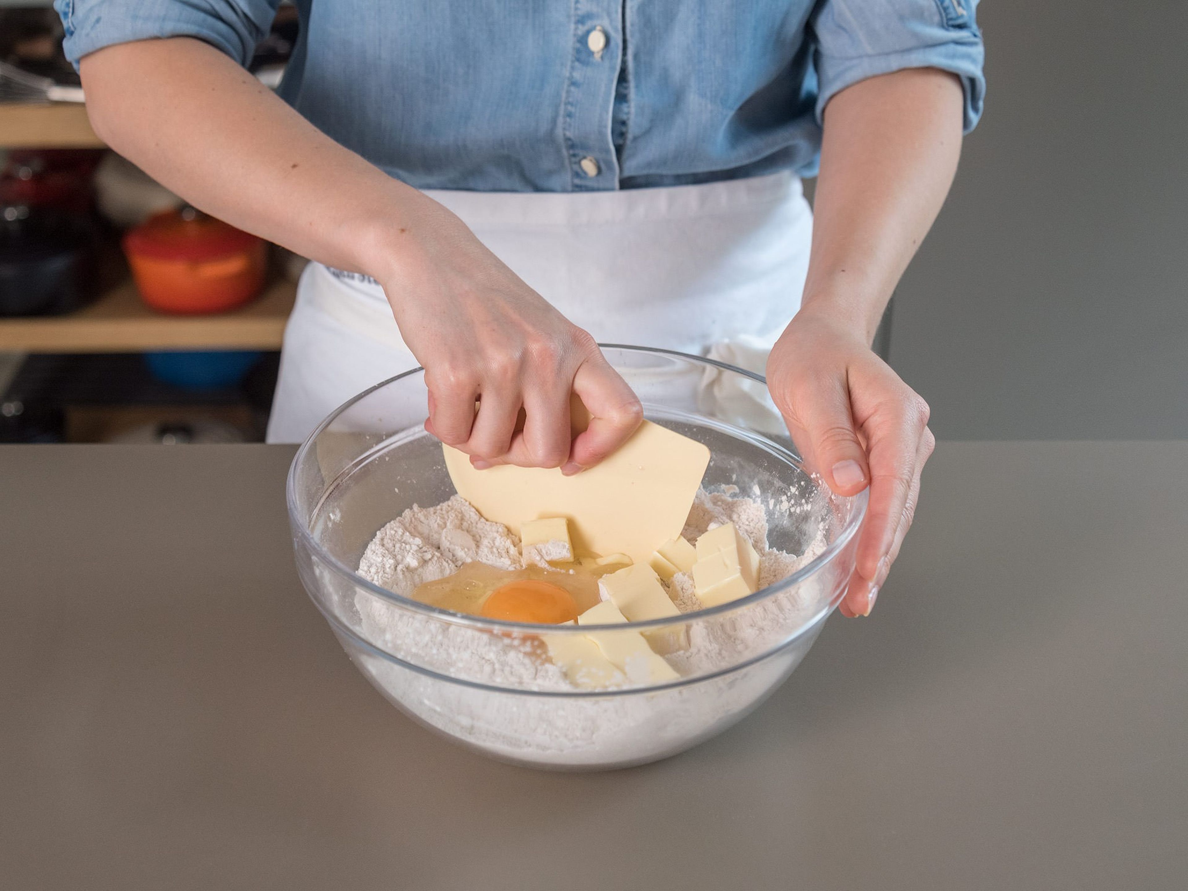 Combine the flour, corn starch, salt, and xanthan gum in a large mixing bowl. Knead in the egg and butter, little by little until combined and a dough forms. Form into a ball, cover with plastic wrap, and transfer to the fridge to rest for approx. 30 min.