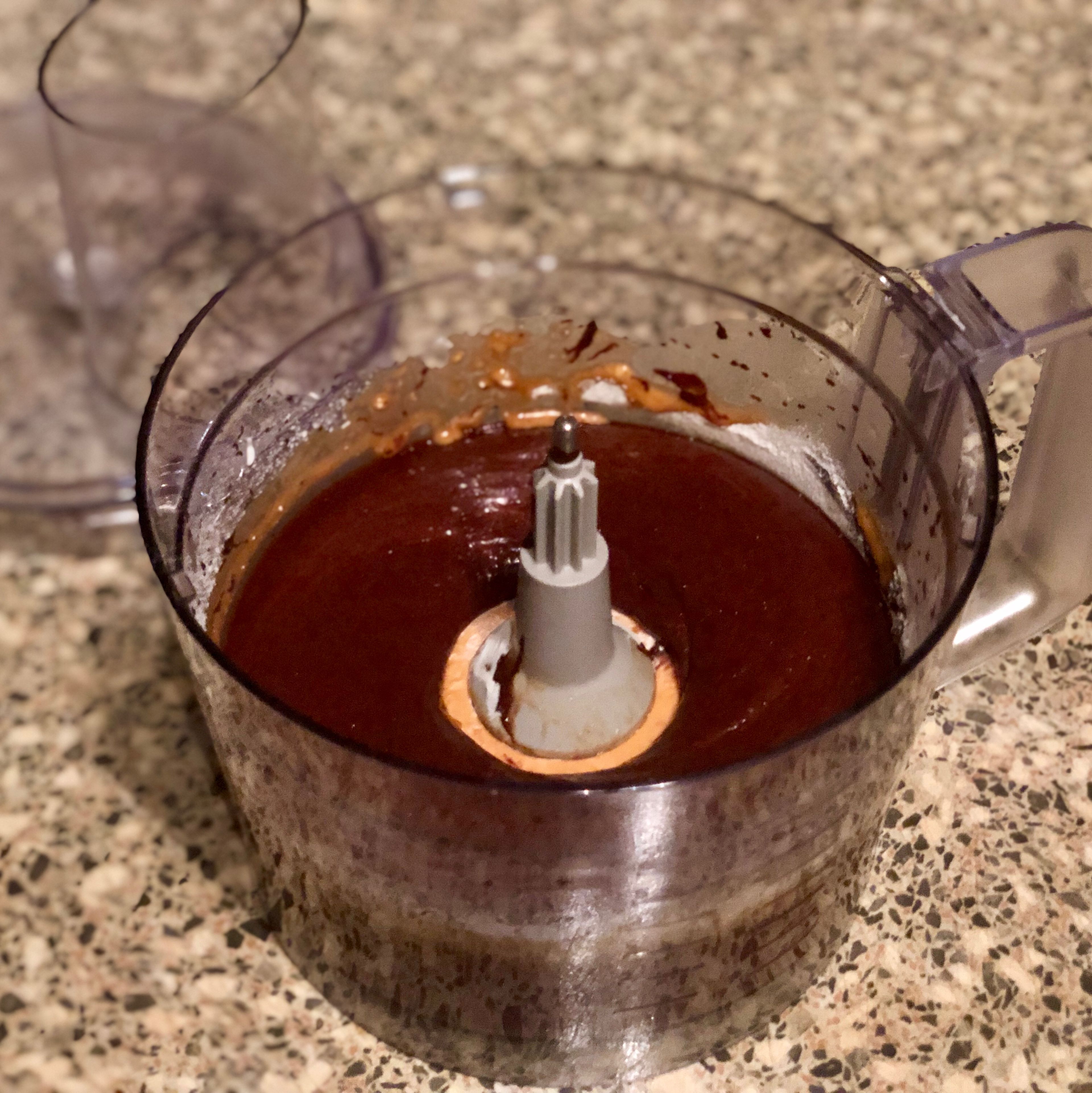 Eggs, sugar, olive oil, salt, vanilla extract, baking powder, flour and already melted chocolate combine in a food processor. Whizz until evenly mixed into a cake batter.