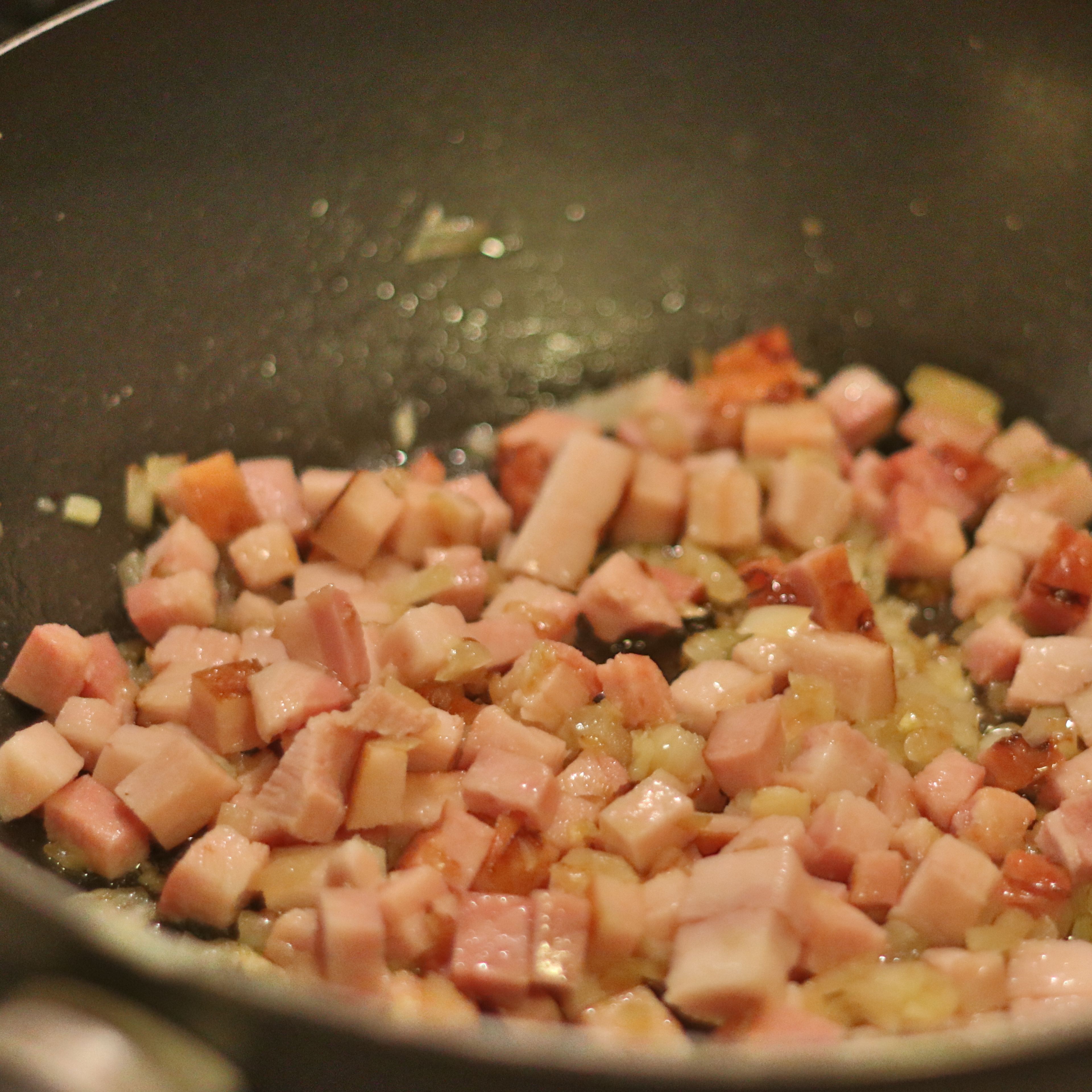 Add bacon and continue cooking on medium heat until soft, approx 5 minutes.