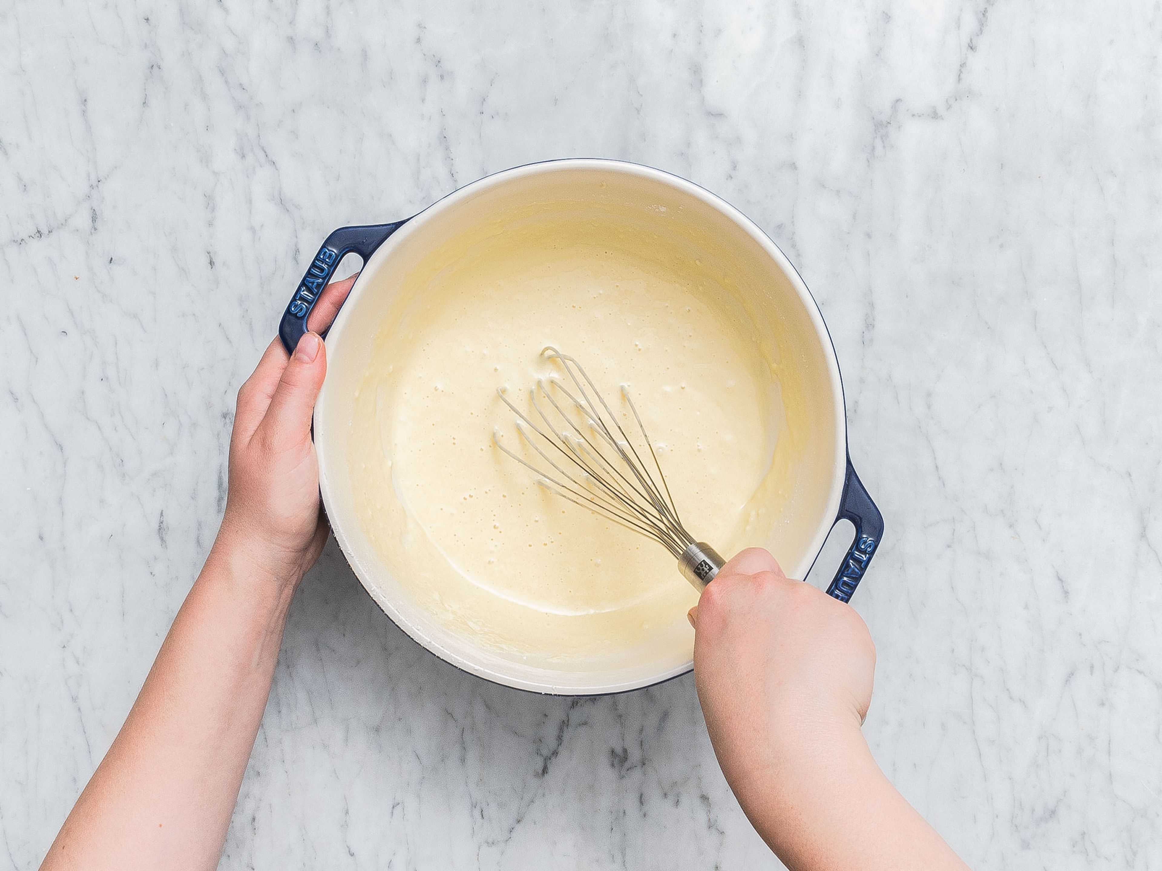 Preheat oven to 220°C/430°F. Add milk, eggs, flour and fine sea salt to a bowl and whisk to combine. Add butter to a cast iron pan and transfer to the oven for approx. 5 min. or until the butter is melted and starts to sizzle.