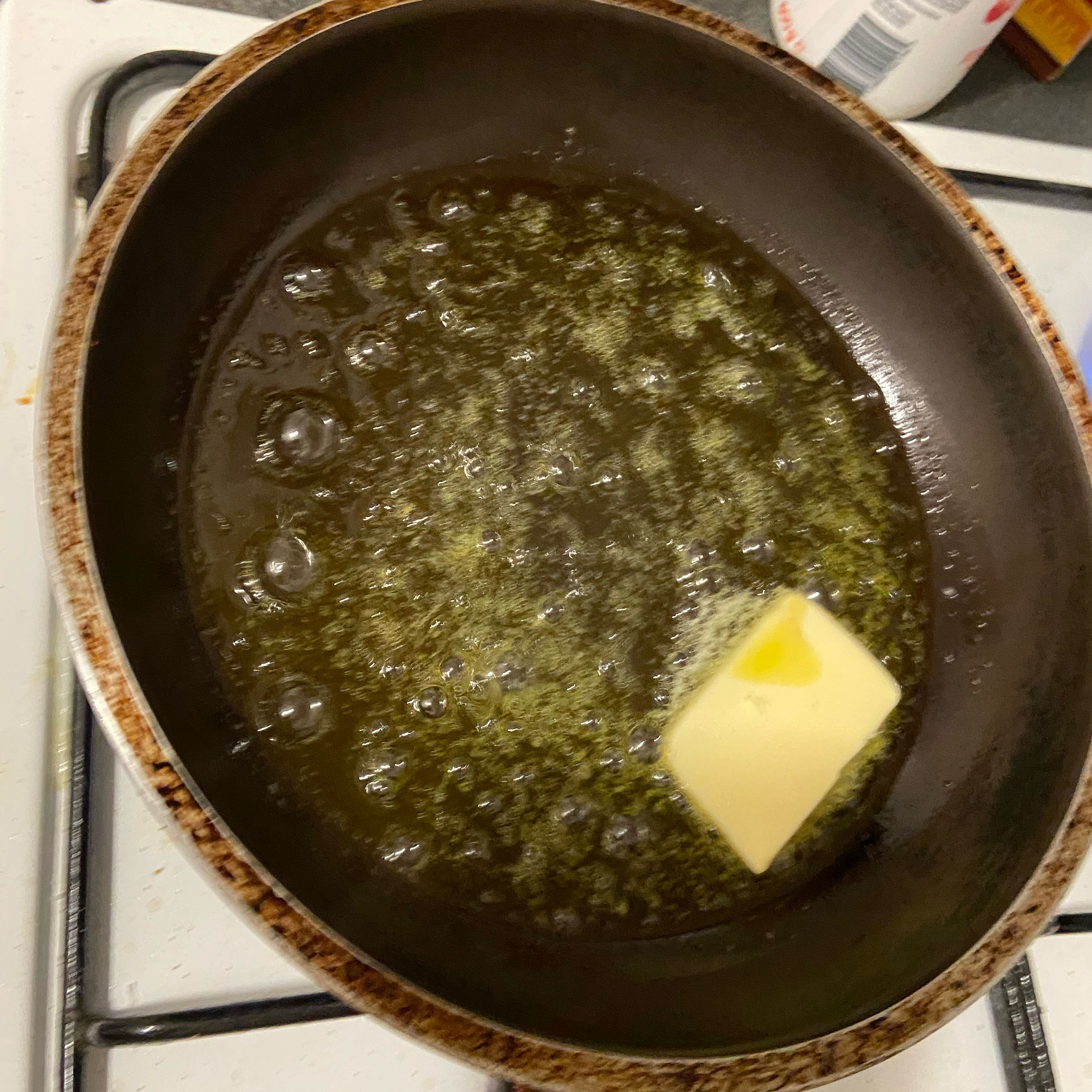 Heat a pan on medium heat and add the olive oil and butter