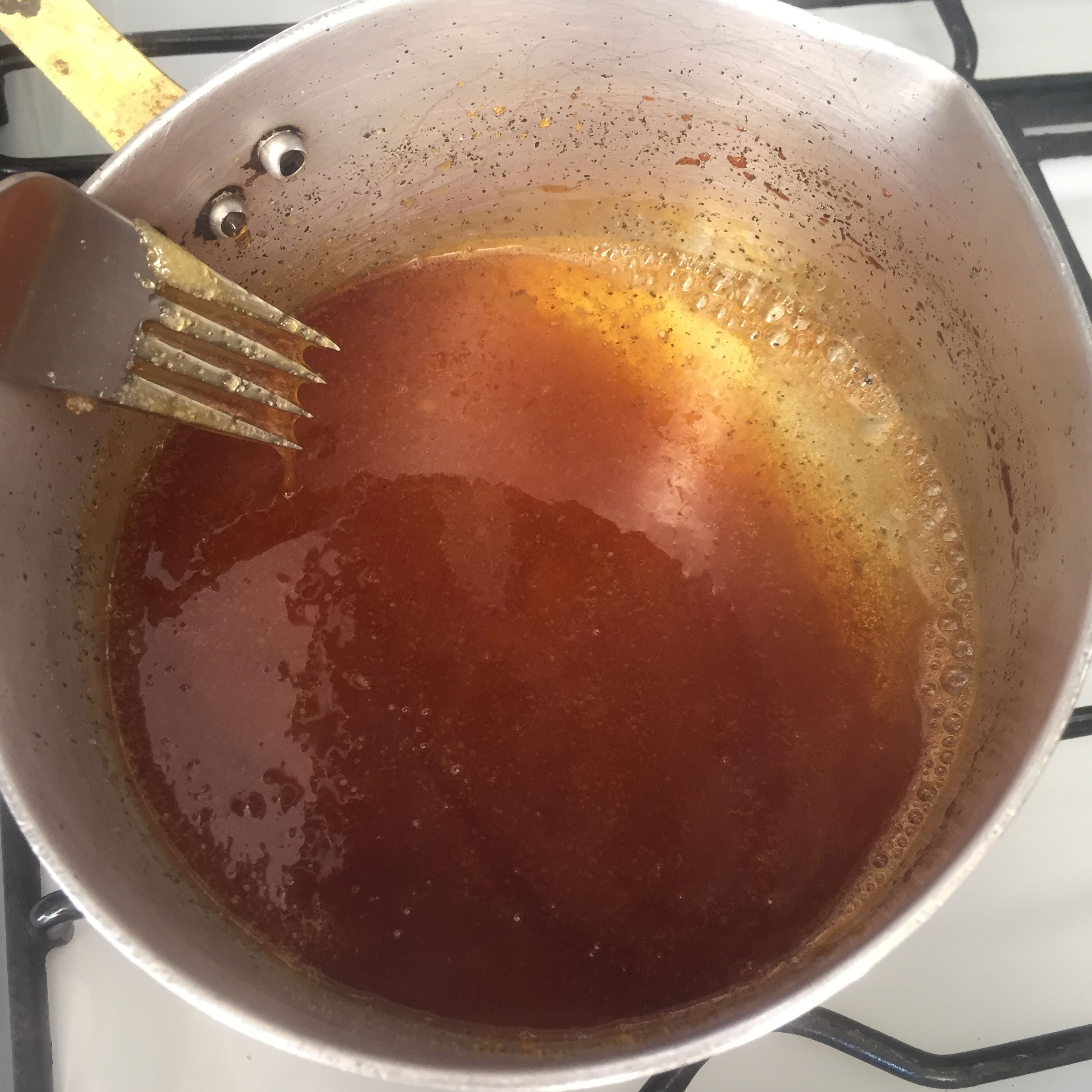 Stir sugar occacionally until it reaches a golden, liquid consistence