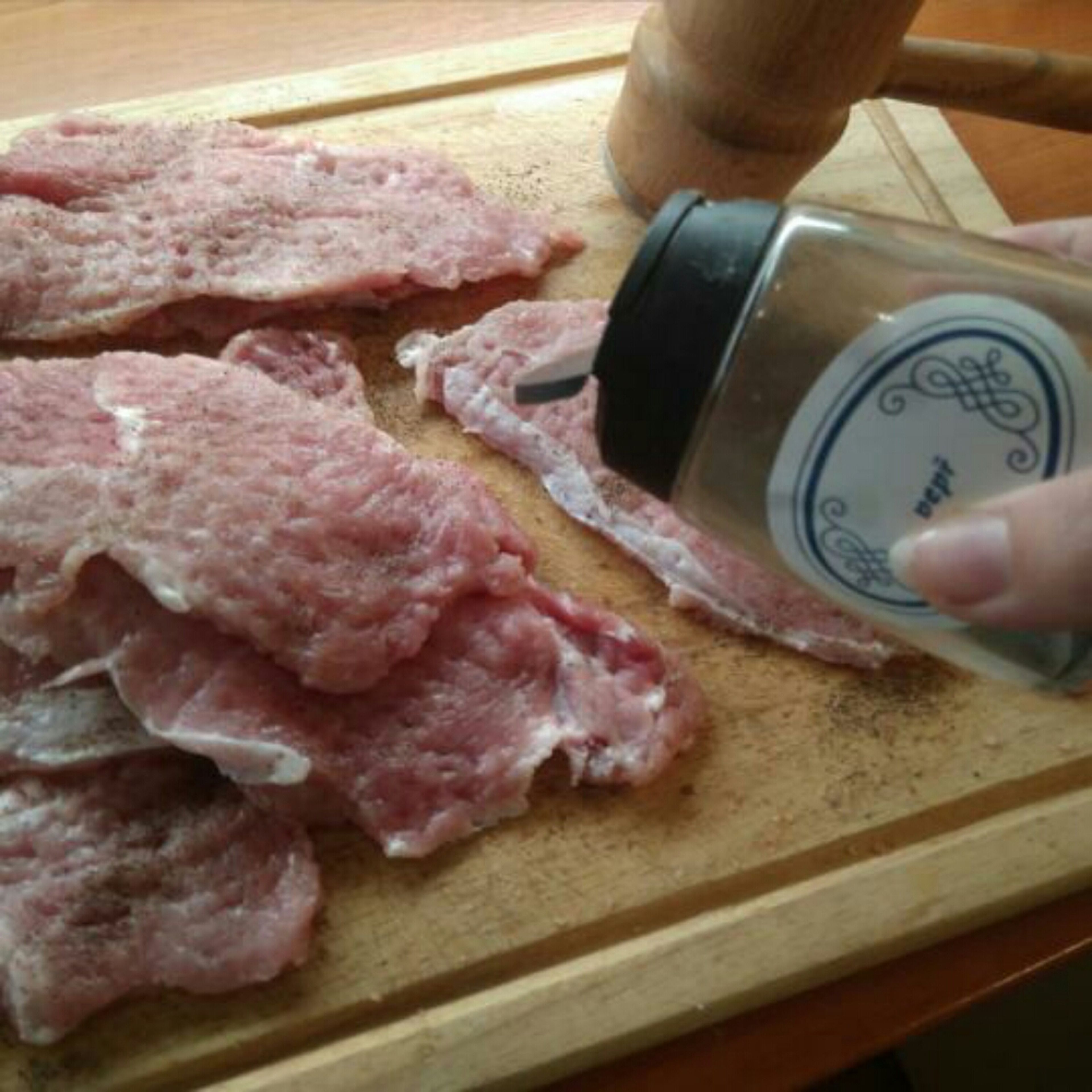Then tap the meat on both sides and salt and pepper.