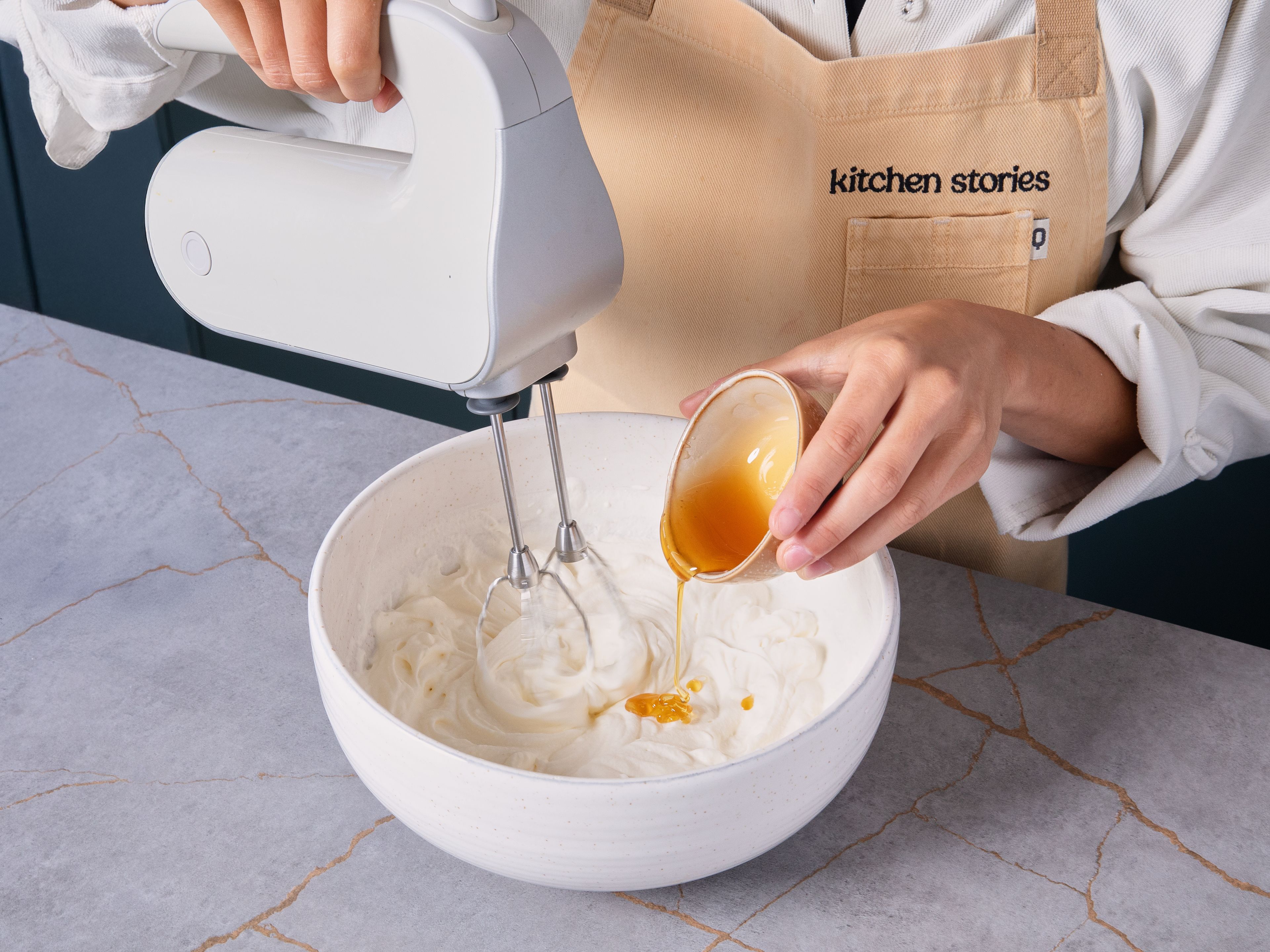 Meanwhile, add the heavy cream to a bowl and whip with a hand mixer until soft peaks form, approx. 5 min. Drizzle in remaining honey and whip to combine. Add warm roasted peaches to a bowl with a dollop or two of the whipped cream alongside. Sprinkle with fleur de sel, if desired. Enjoy!