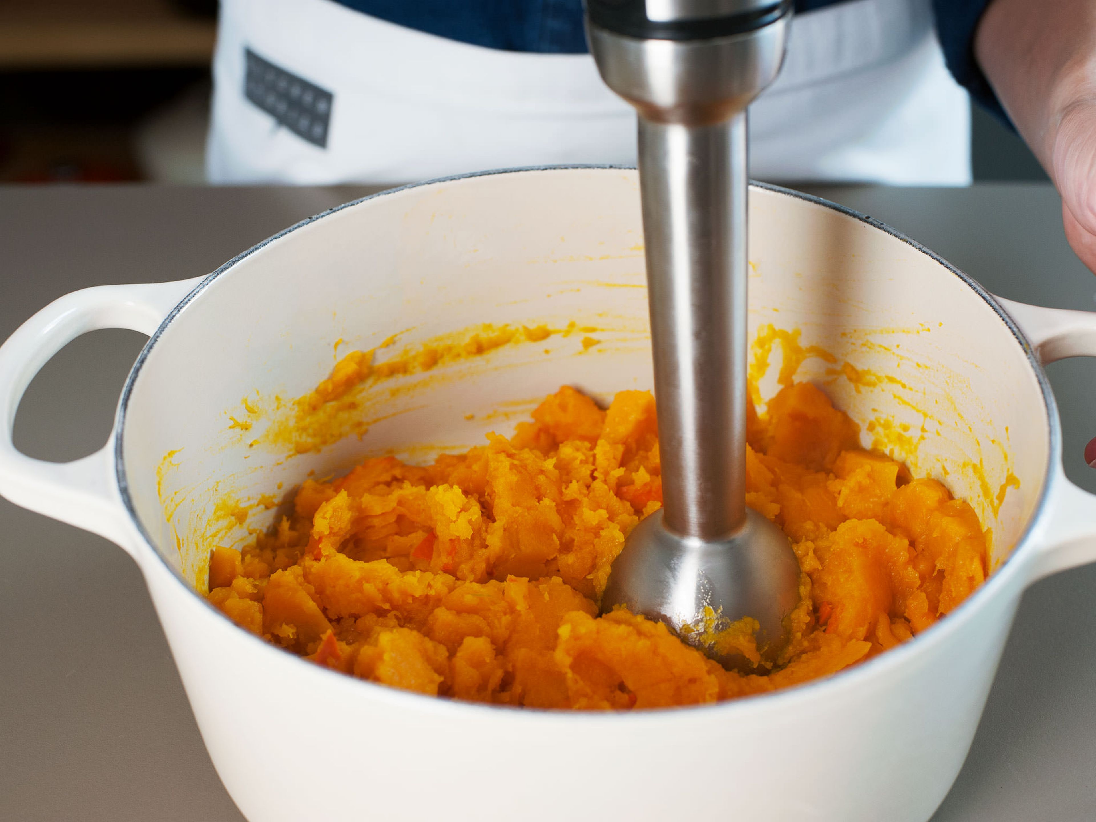 Purée pumpkin and place in a fine strainer to drain.