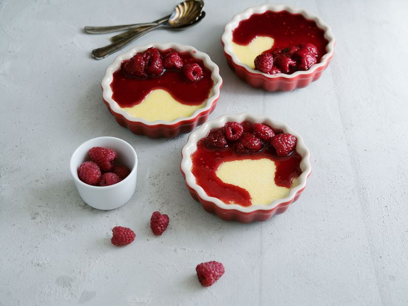 Baked vanilla pudding with warm raspberries