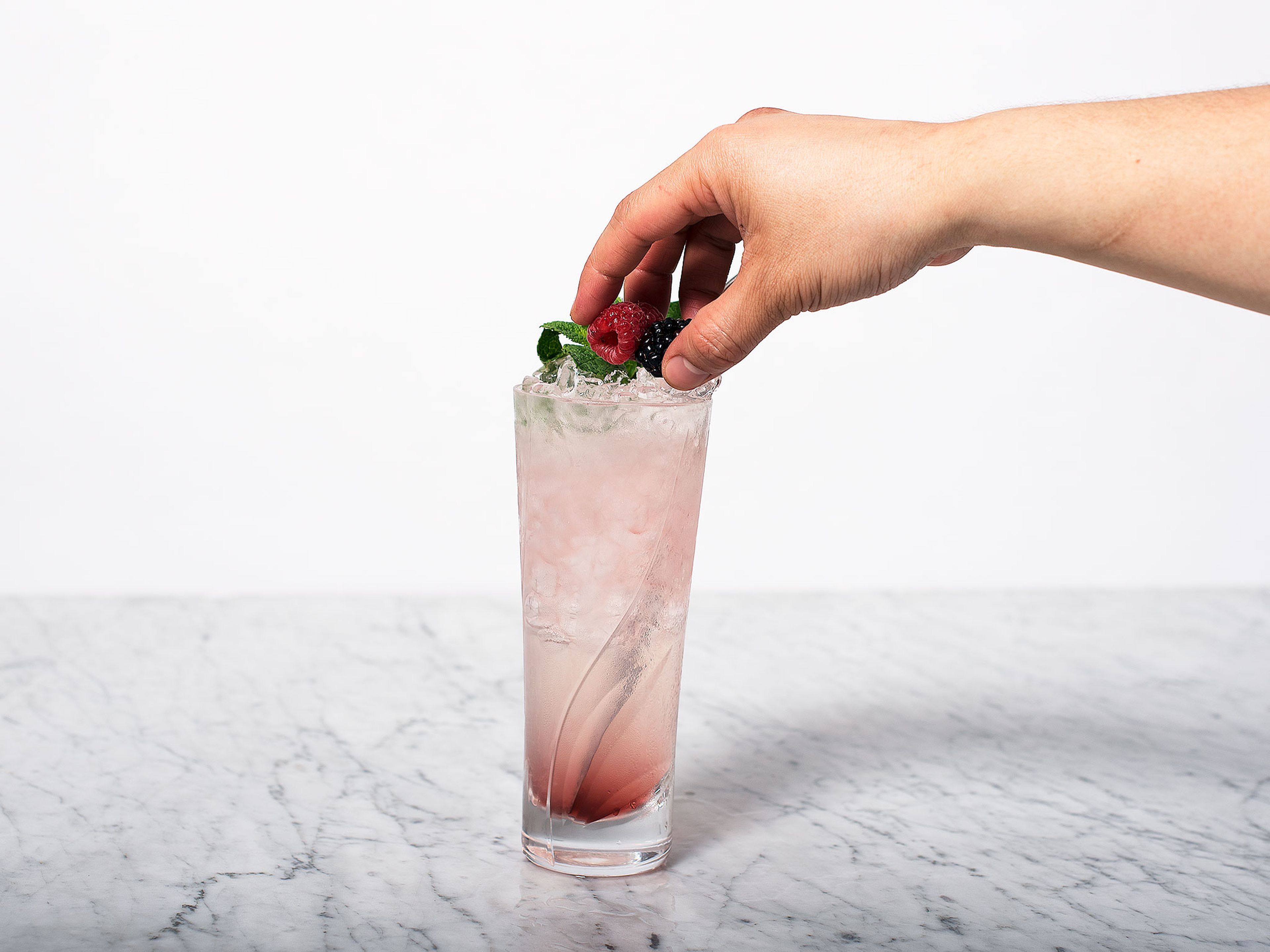 Garnish with mint and berries. Serve with a straw and enjoy!