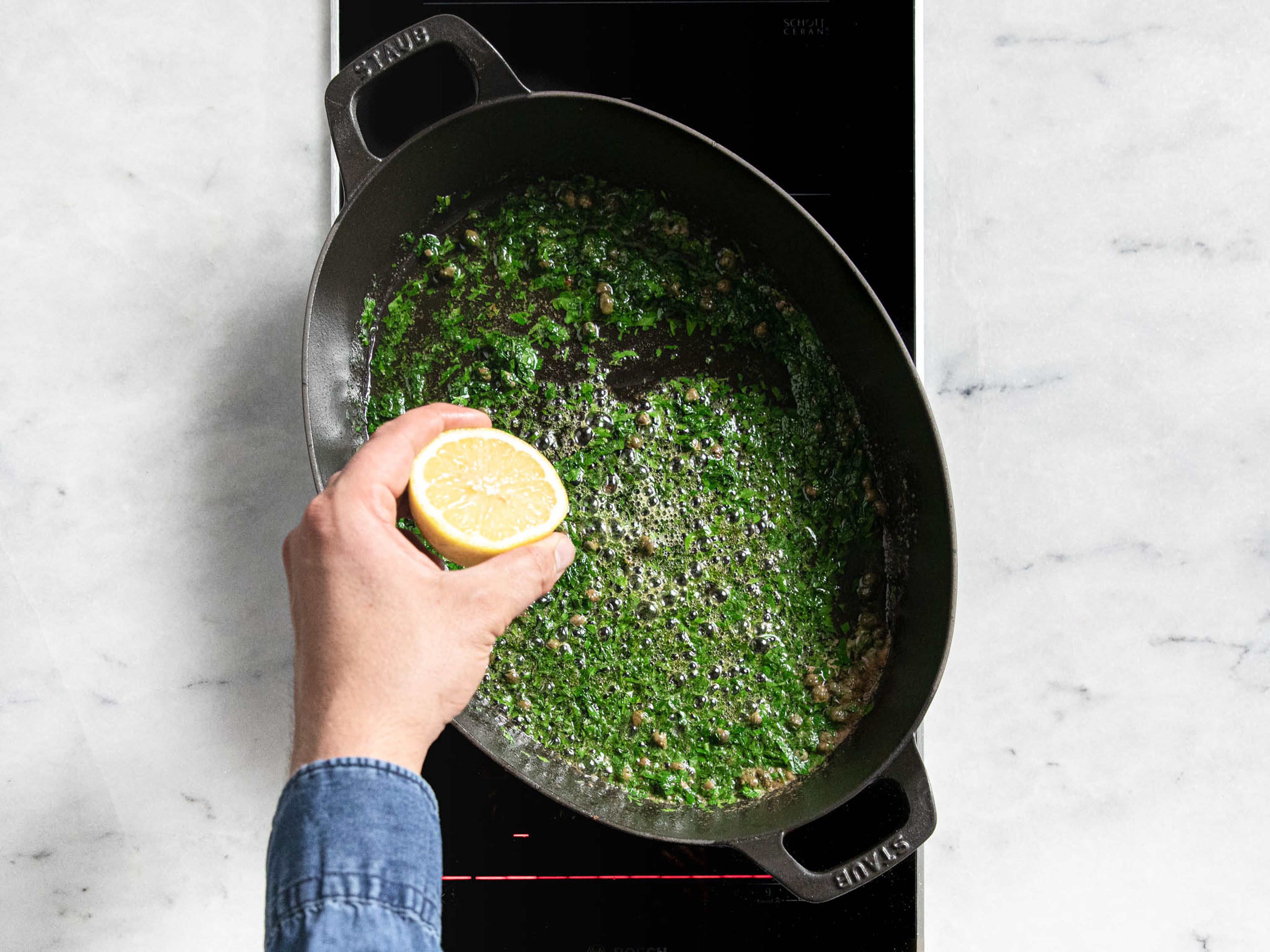 Finely chop parsley. In the same pan, heat butter until browned. Remove from heat. Toss in capers and parsley, juice lemon into pan, mix, and serve with the fish. Season with salt and pepper to taste. Enjoy!