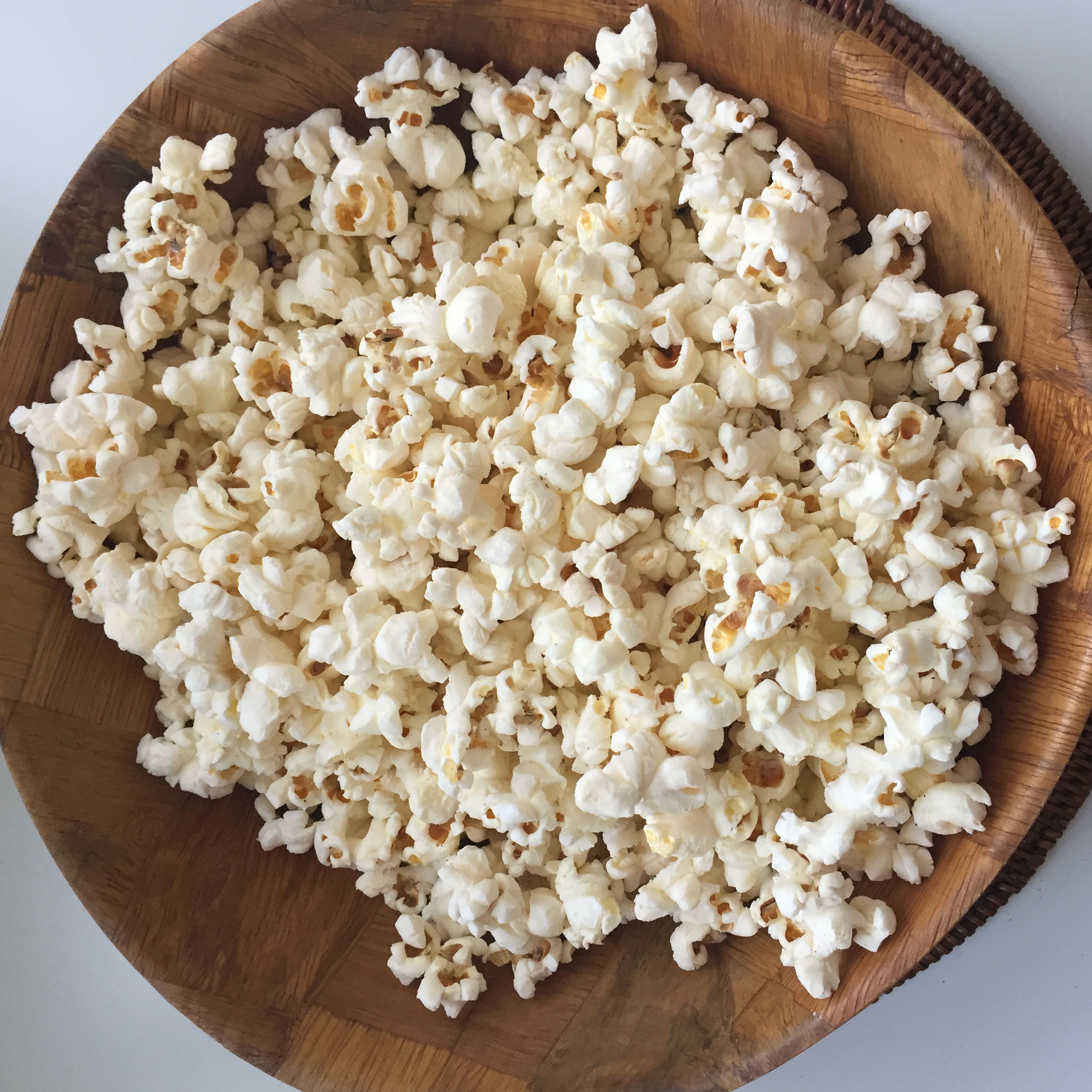 Place popcorn in a bowl, and season to taste. Enjoy!
