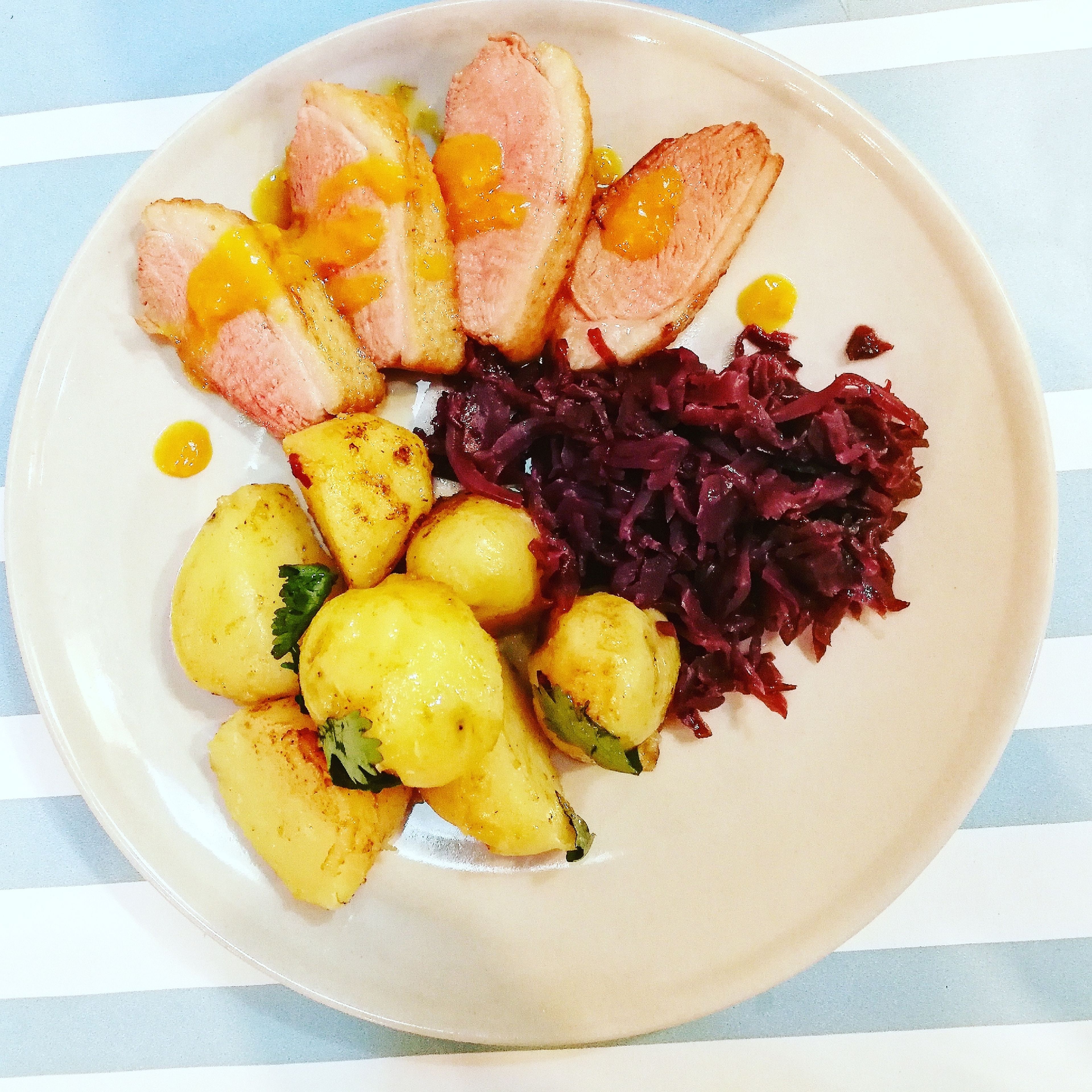 Roast duck with red cabbage and new potatoes