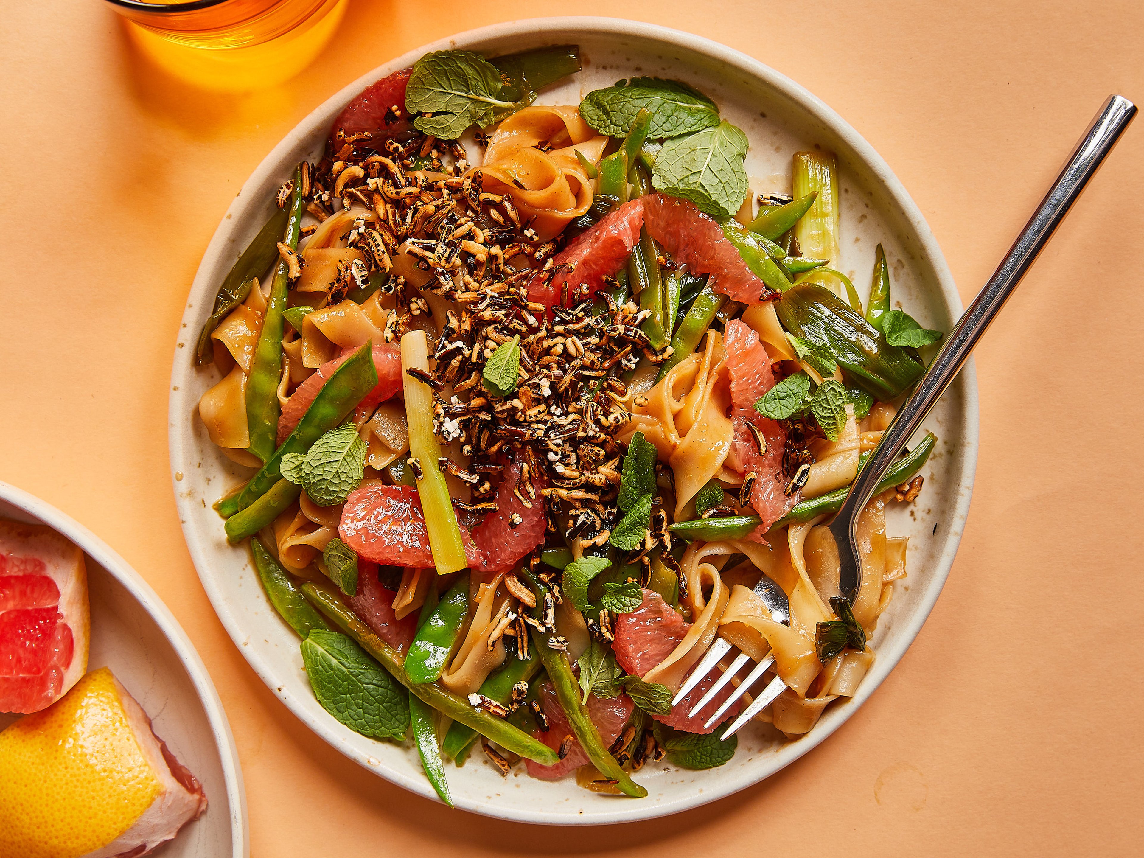 Stir-fried noodles with grapefruit and crispy rice