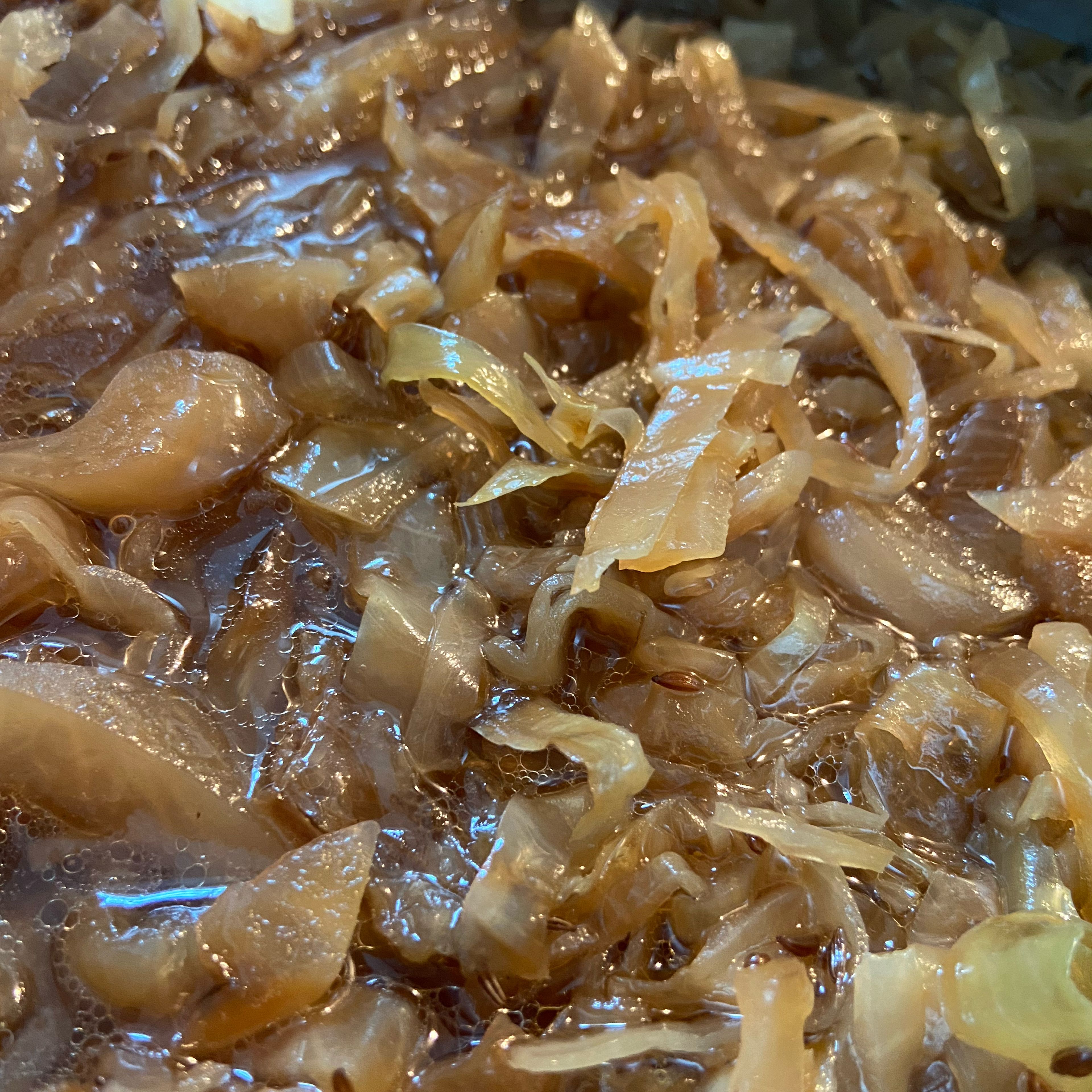 Add 1/2 tbsp caraway seeds, 1 tbsp brown sugar, 1 pinch of salt and pepper to the cabbage and let simmer gently for approx. 1 hr.