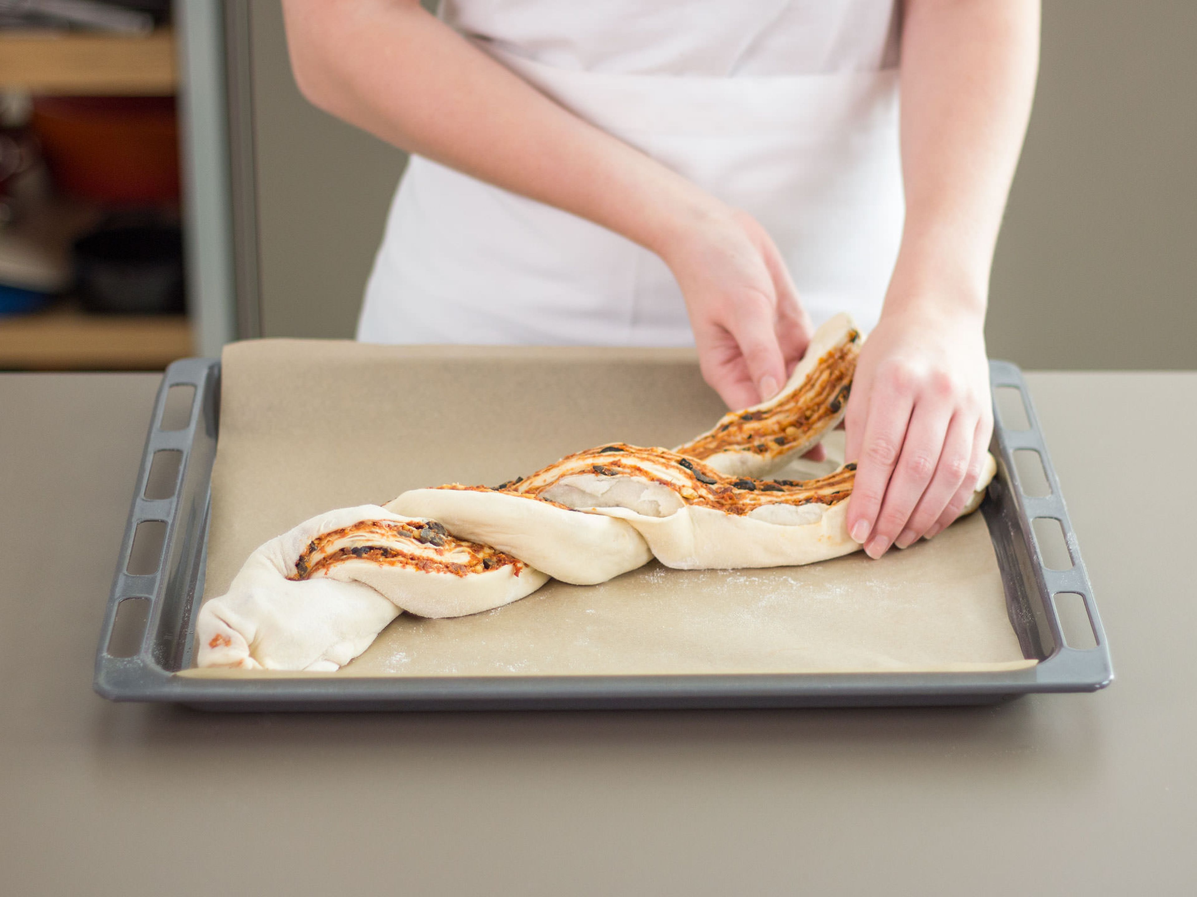 Transfer dough to a parchment-lined baking sheet. Cut dough log in half lengthwise and then braid into a loaf. Transfer to preheated oven and bake at 180°C/350°F for approx. 35 – 45 min. Remove from oven and allow to cool or enjoy warm right away!