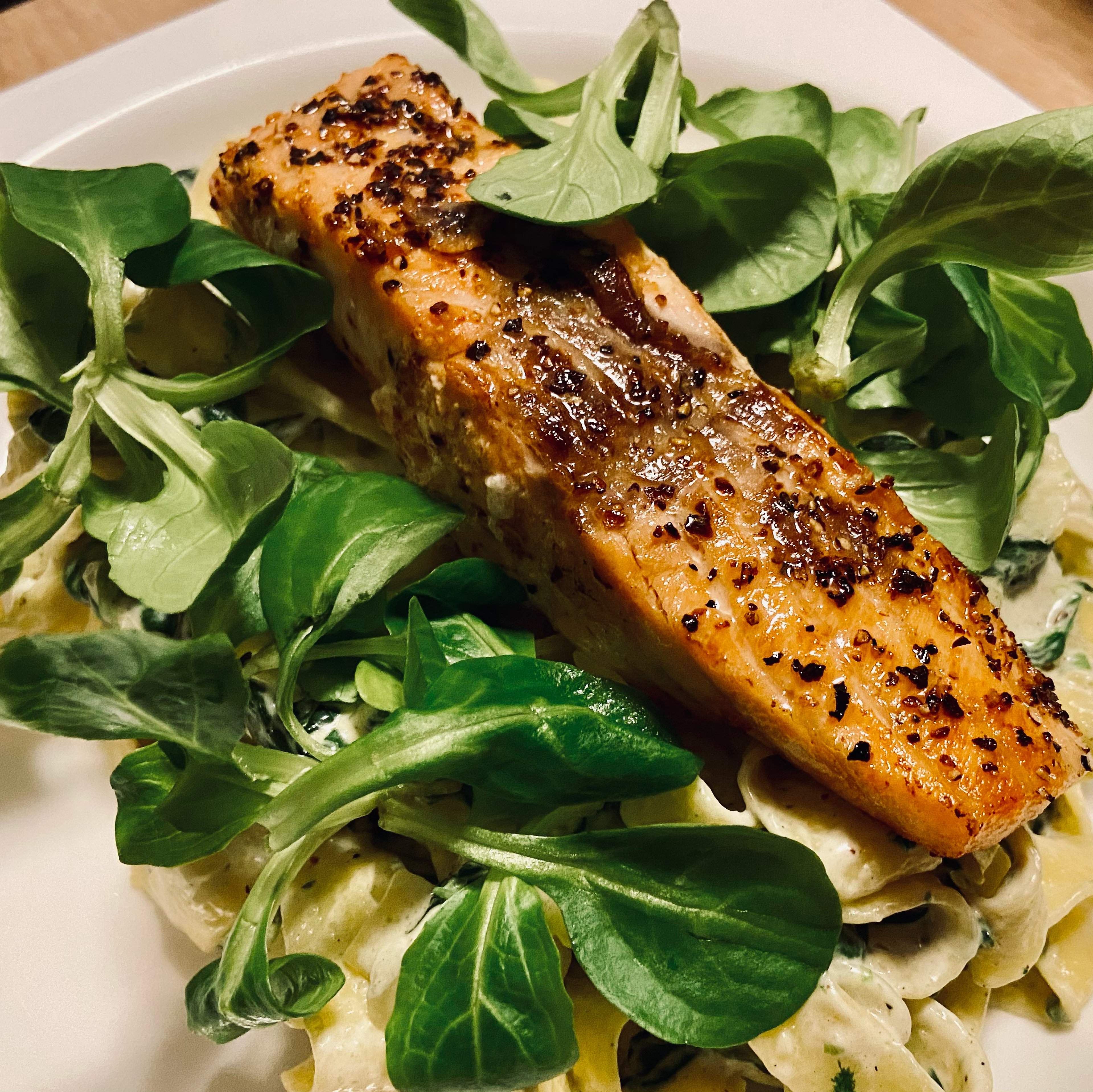 Salmon with creamy white sauce pasta