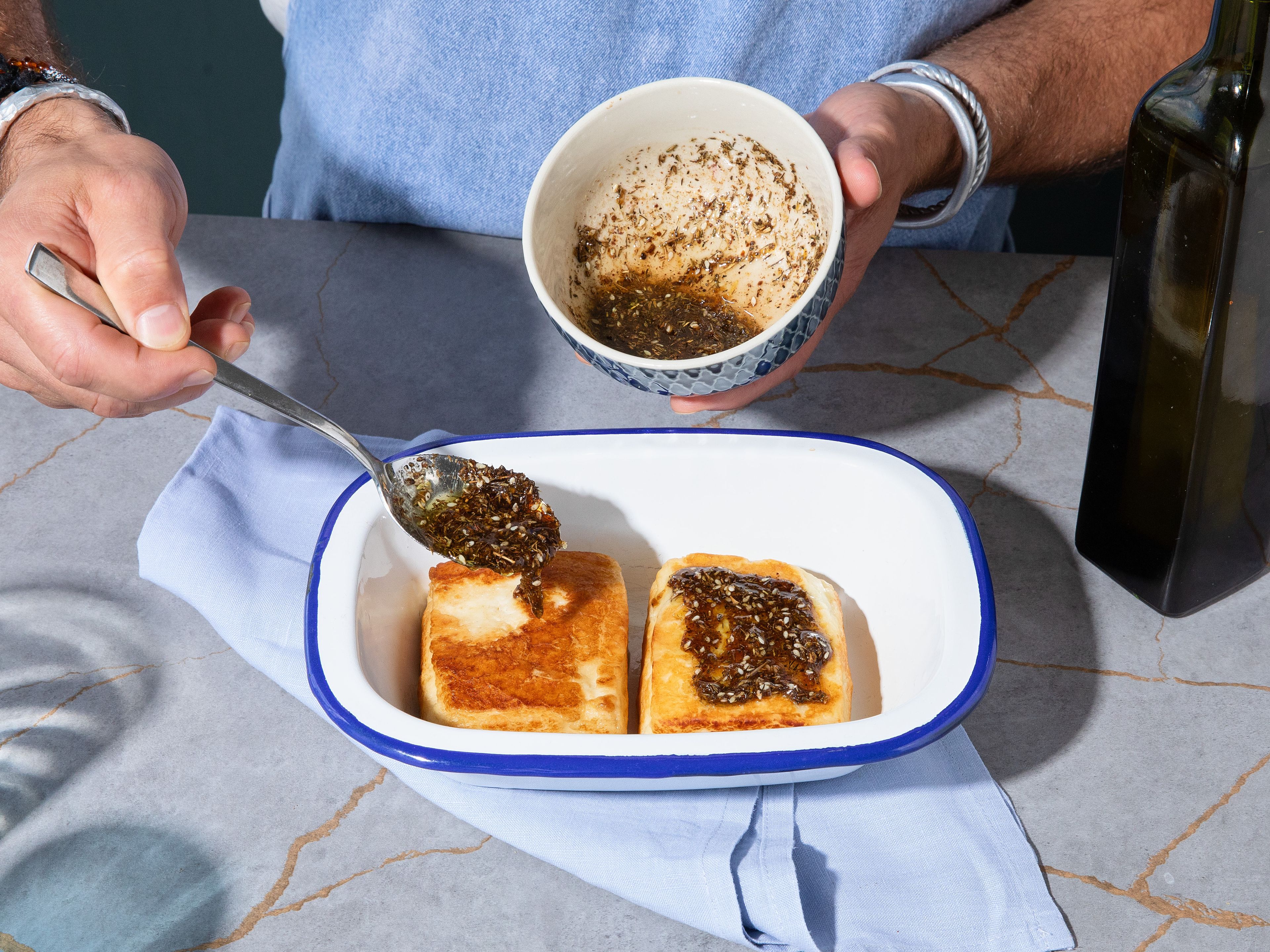 Distribute prepared glaze onto seared halloumi blocks, transfer to the preheated oven and bake for approx. 5 min. until cheese gets soft inside.