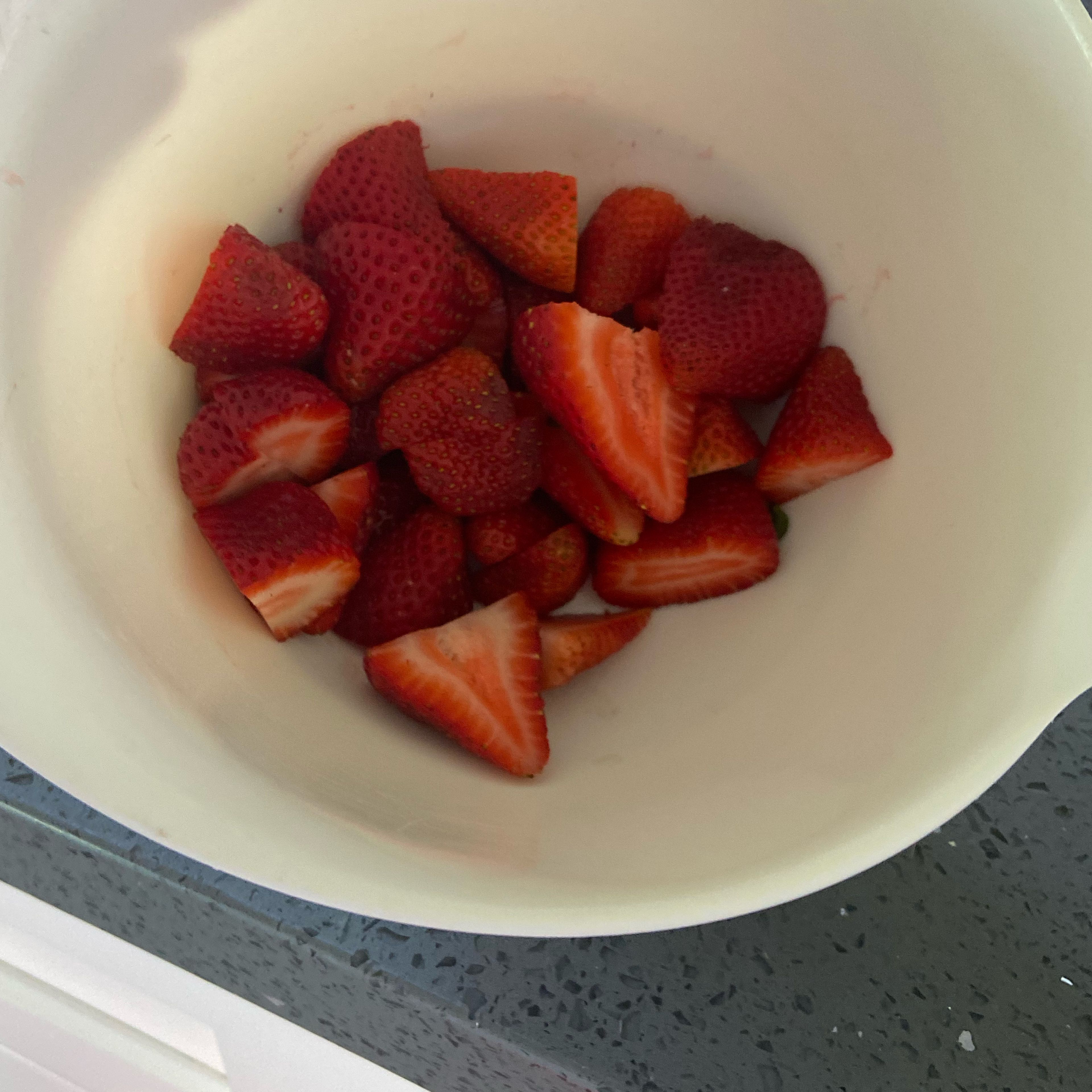 Pour the strawberries into a bowl