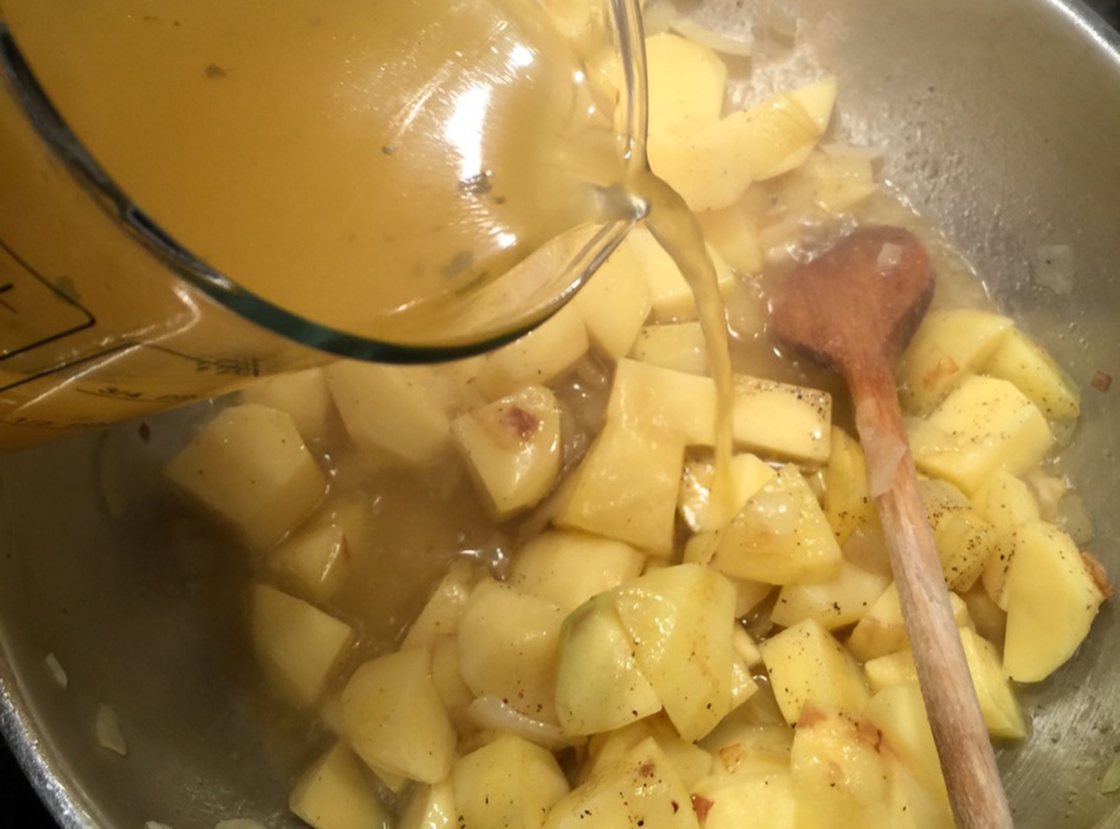 Add half of the vegetable broth and soy cream and stir to combine. Let the mixture simmer over medium-low heat for approx. 20 min., or until the potatoes are soft.
