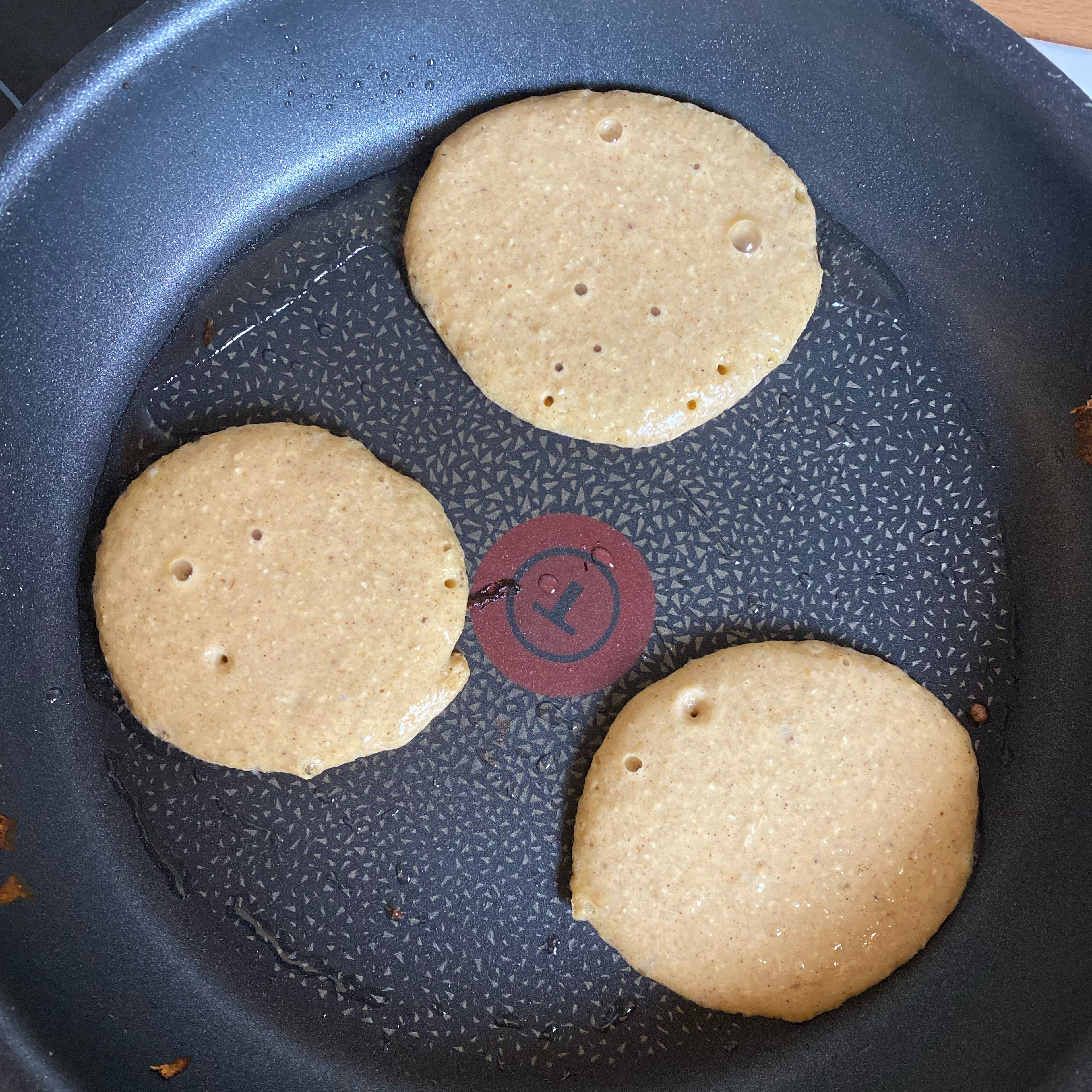 Spread coconut oil to the pan before frying each pancake. Use a ladle to count the portion for each pancake. Wait 1 min max and carefully flip the pancake using a spatula. Repeat until the mixture is finished.