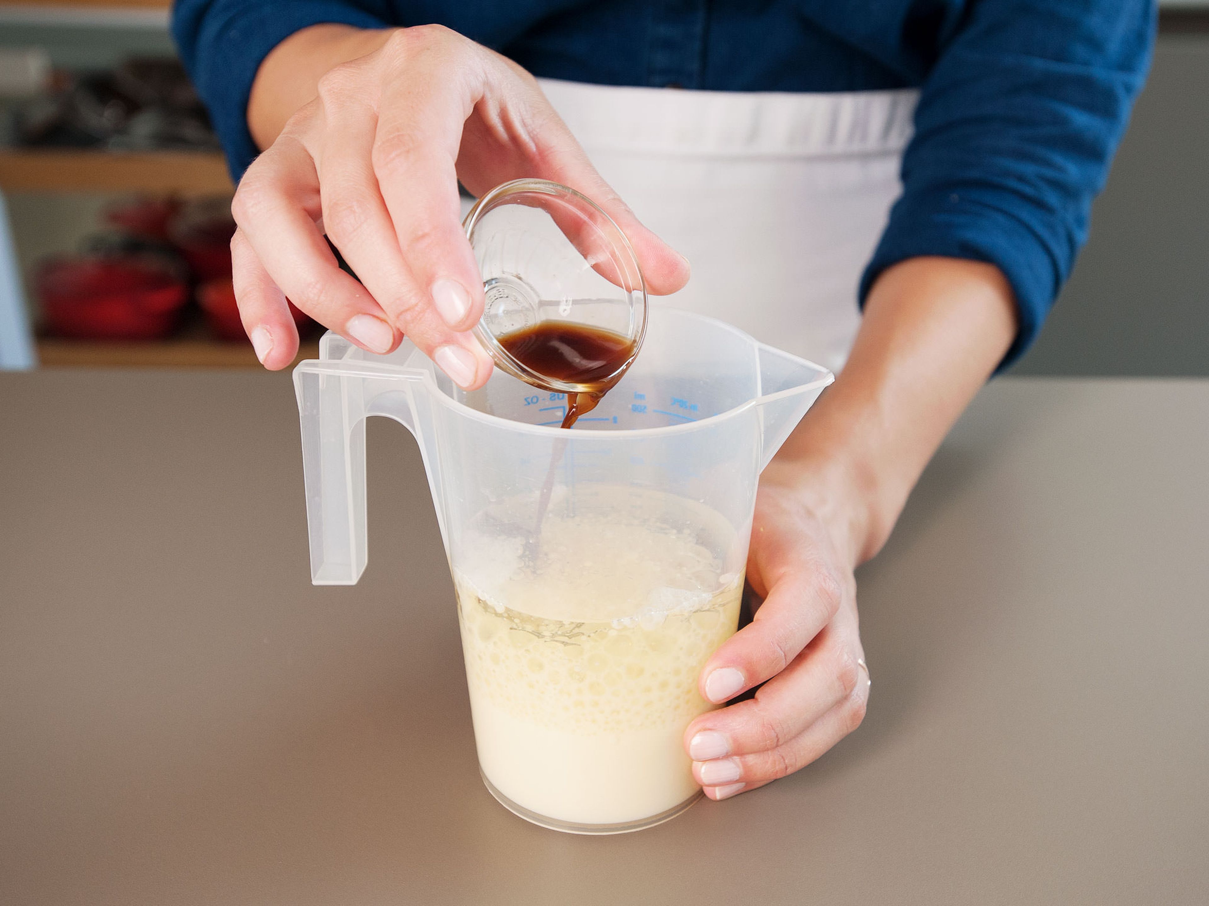 Next, whisk together vegetable oil, milk alternative, and vanilla extract in a large measuring cup.
