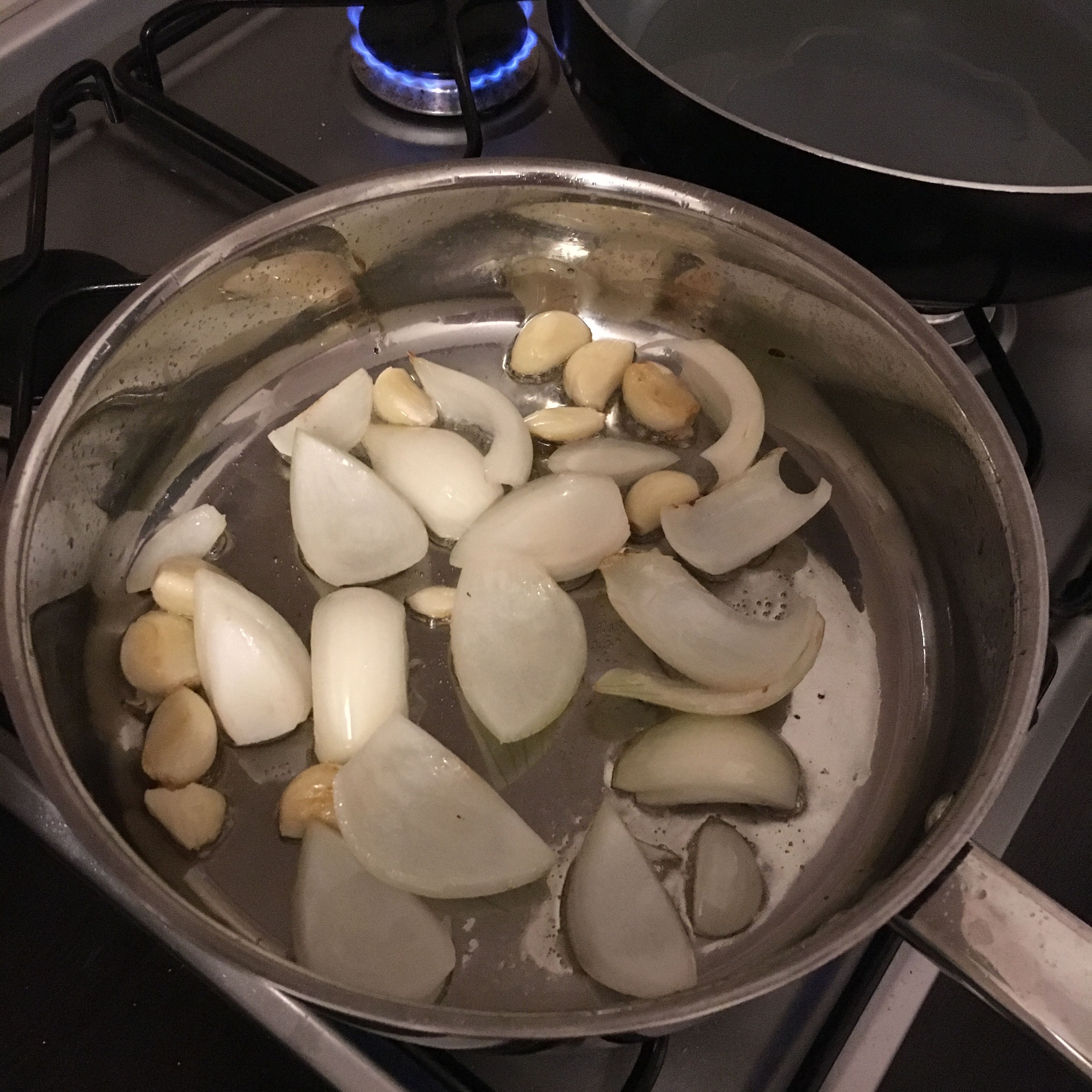 First oil fry garlic and onion