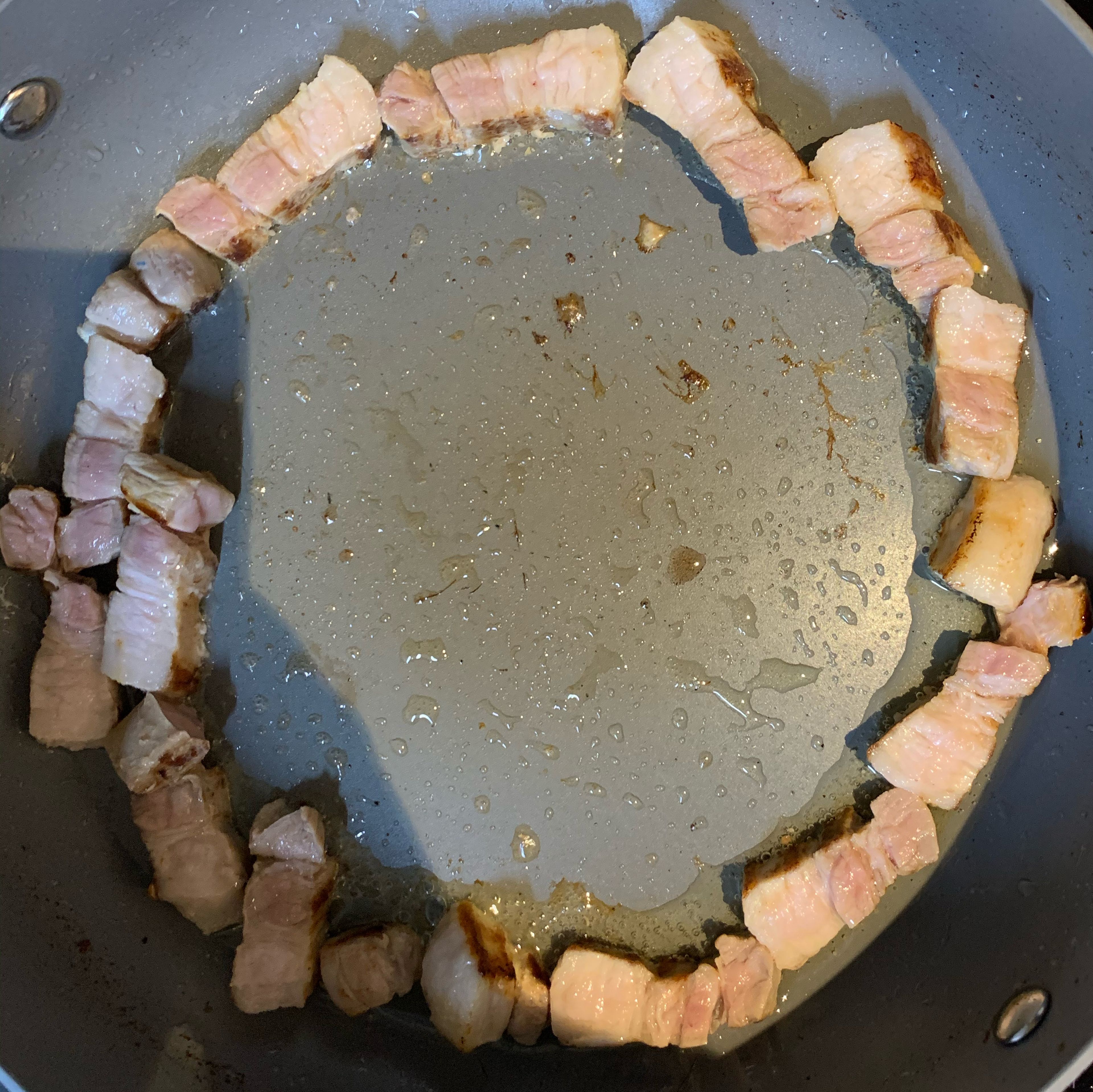 Grill the diced pork belly again on a frying pan.