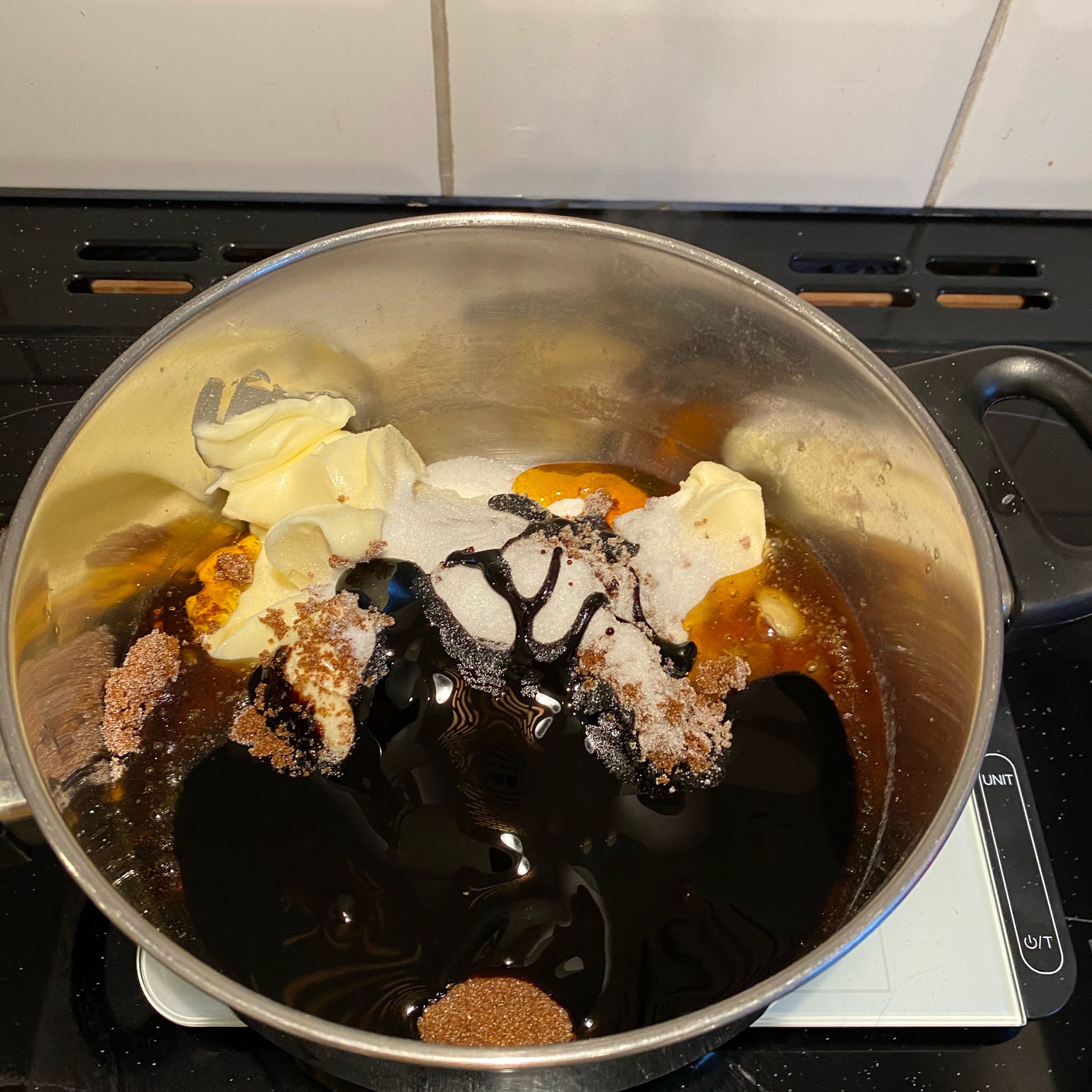 Melt sugar, butter, treacle and syrup in a pan
